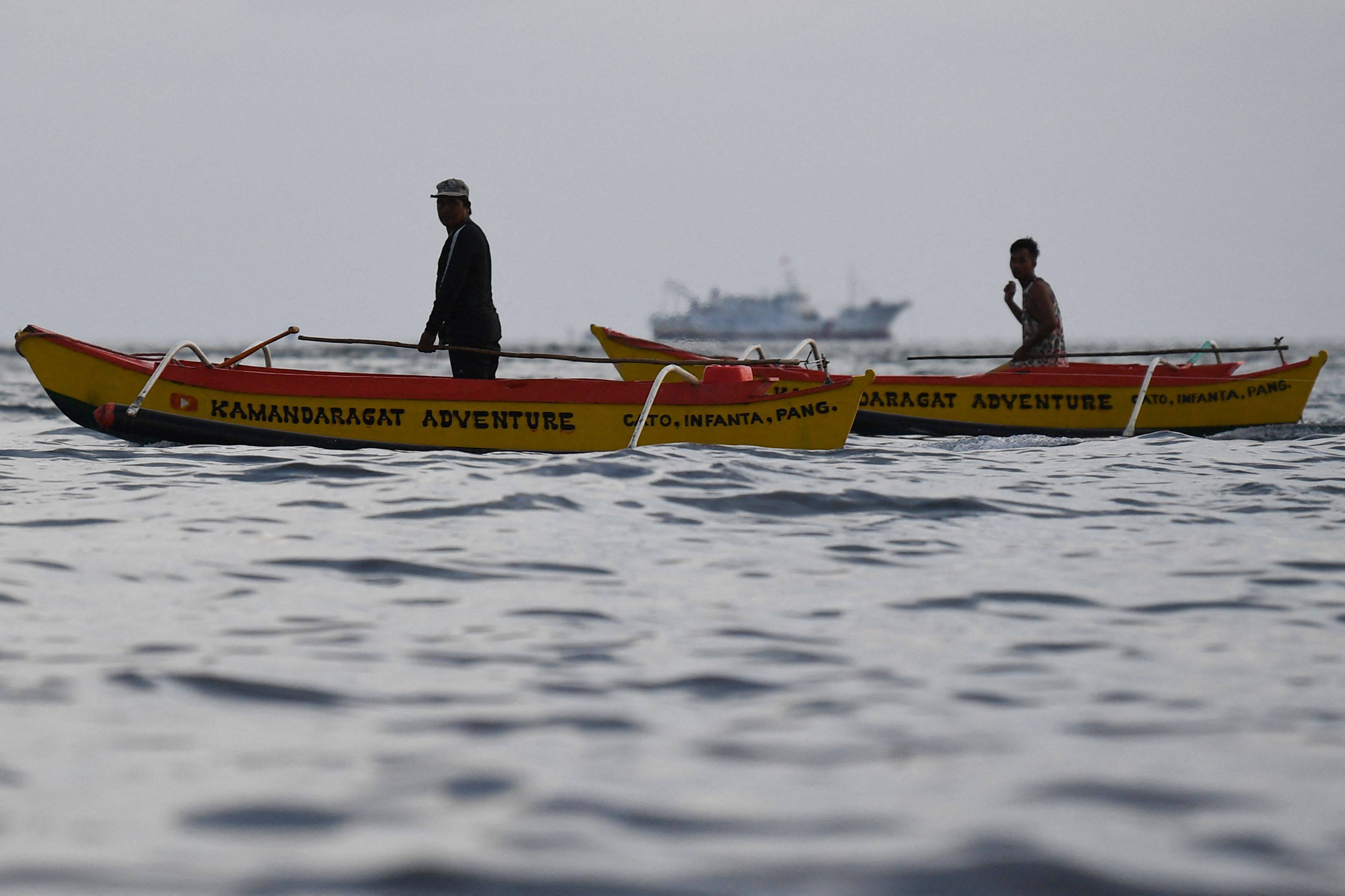 Filipino fishermen working in disputed waters of the South China Sea last month. Photo: AFP