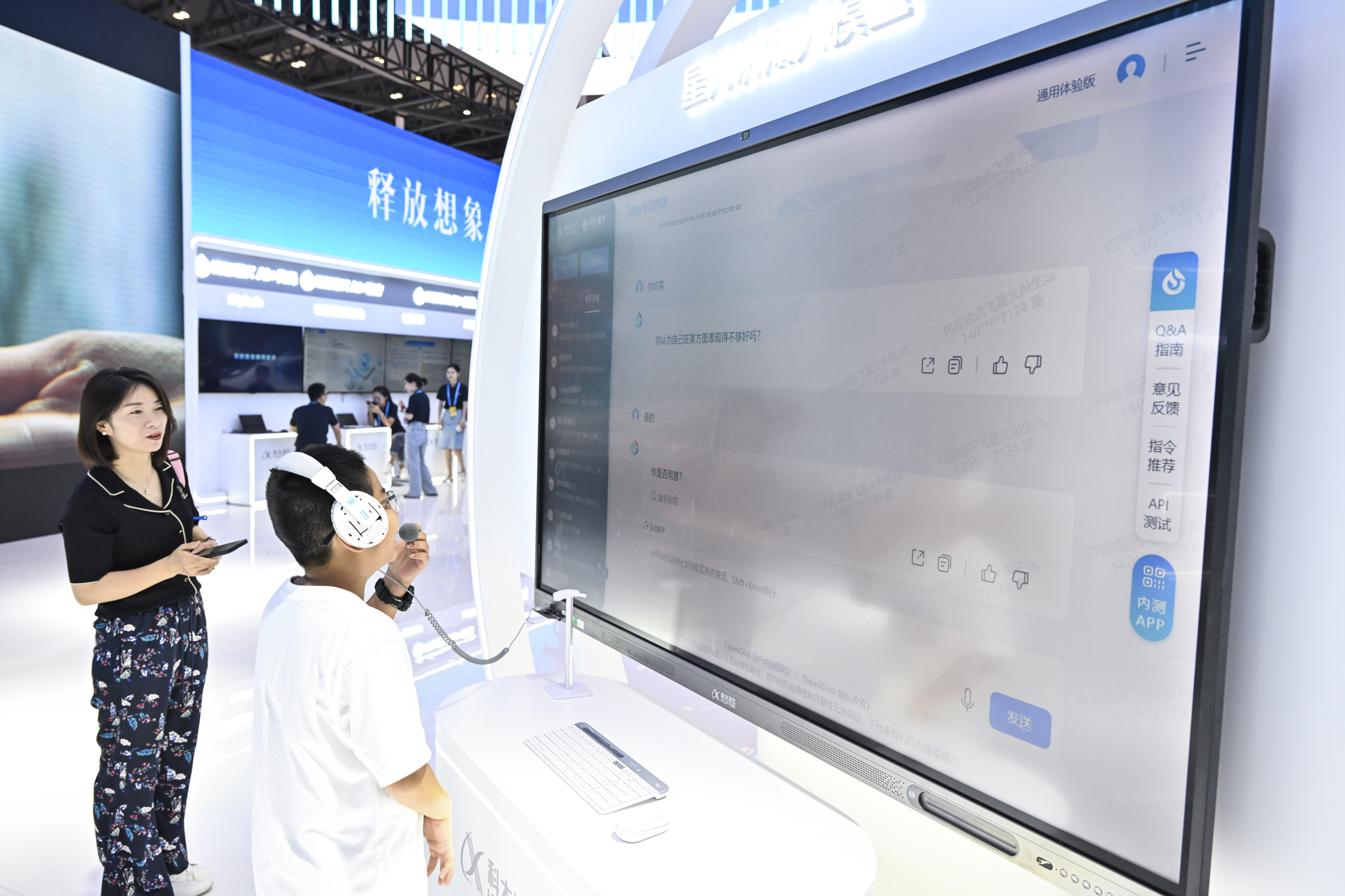 A boy uses the AI-powered large language model “Spark Desk”, launched by Chinese AI firm iFlytek, at the 2023 Smart China Expo in Chongqing, on September 3. Photo: Xinhua