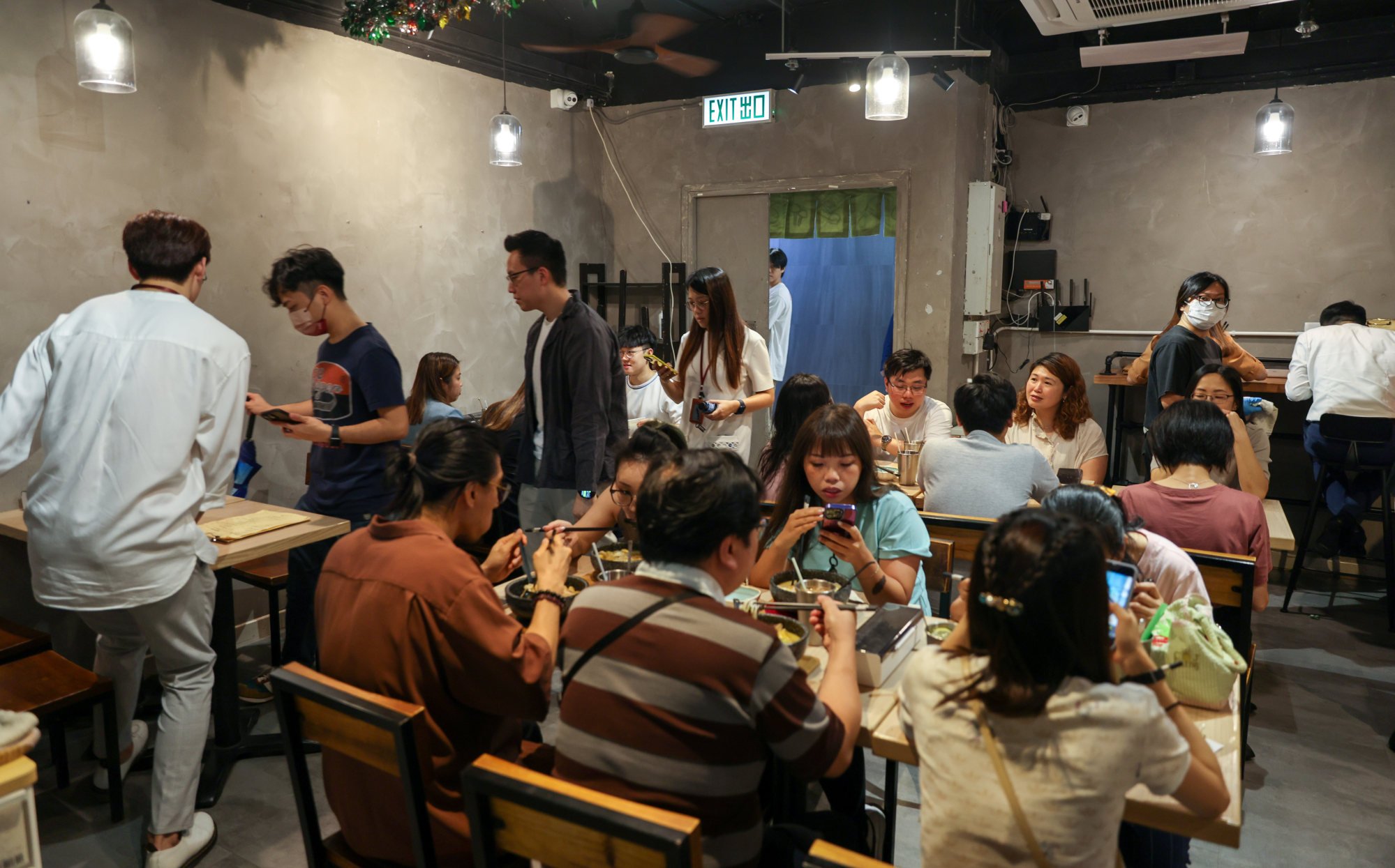 Customers dine at an eatery in Camel Paint Building in Kwun Tong. Photo: Yik Yeung-man
