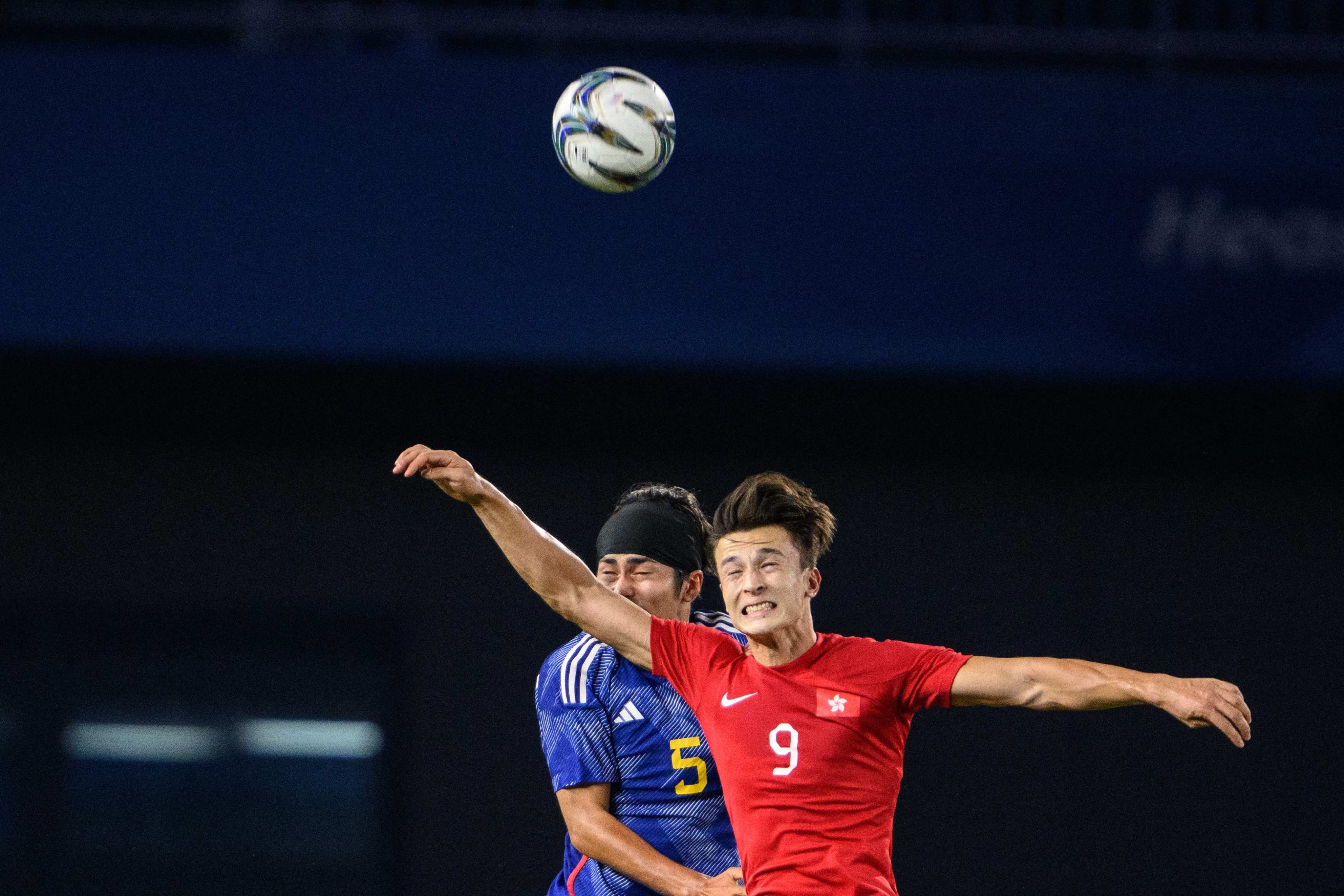Japan’s Seiya Baba and Hong Kong’s Mathew Orr compete for the ball in their men’s football semifinal at the Asian Games. Photo: AFP