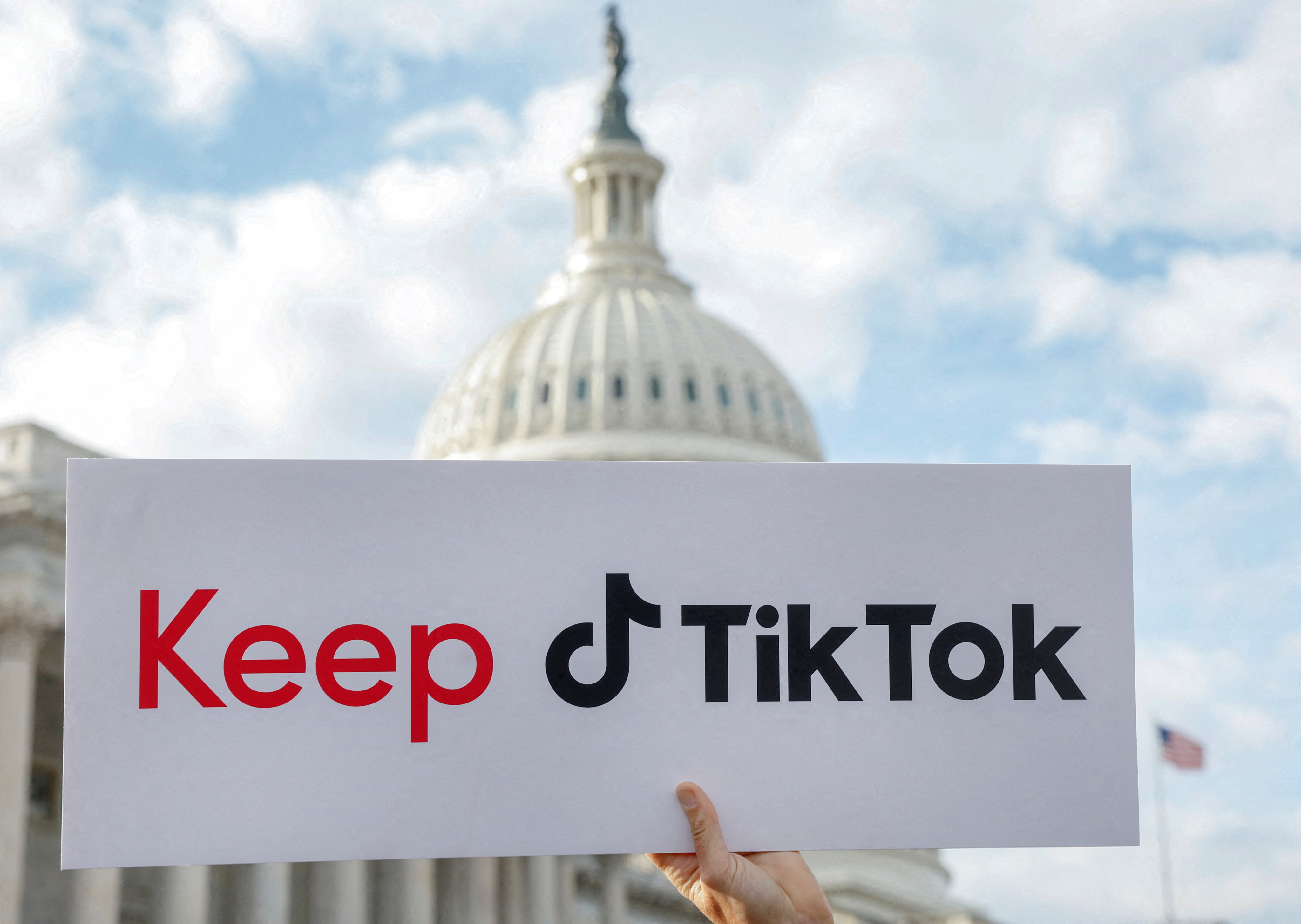 A sign is held up in front of the US Capitol as TikTok creators hold a news conference to speak out against a possible ban on the app in March. Photo: Reuters
