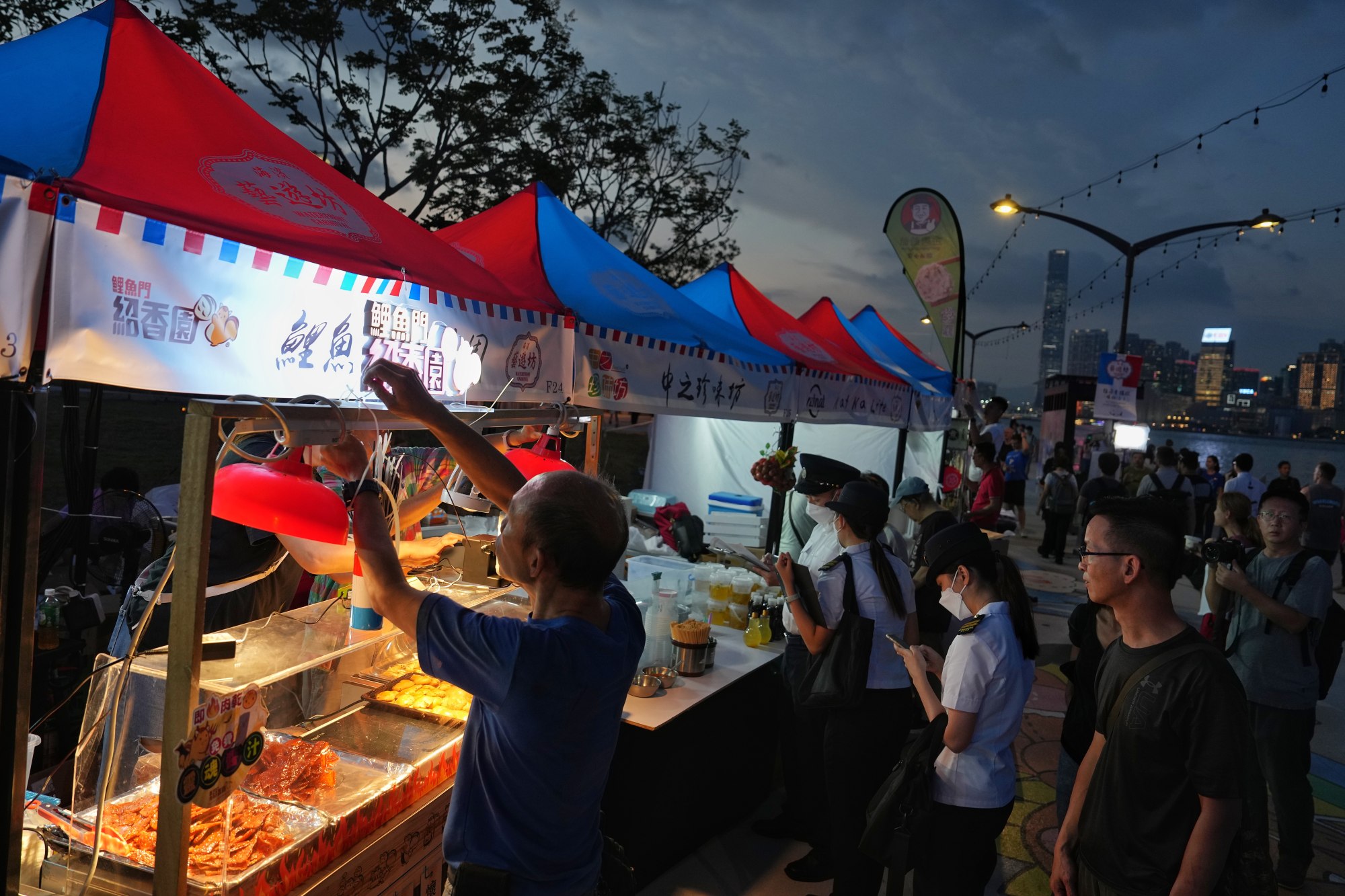 Food stalls get ready for business at one of the night events designed to boost the after-dark economy. Photo: Elson LI