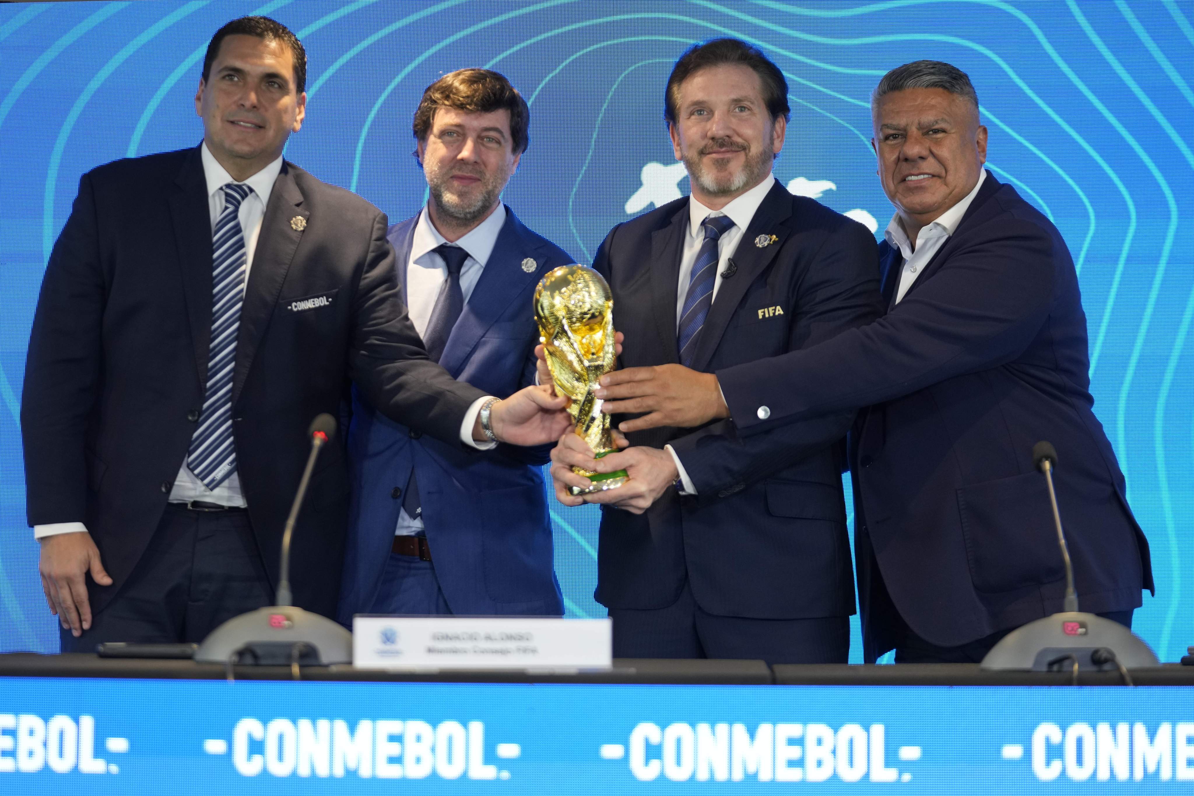 (From left) Paraguay’s Soccer Association President Robert Harrison, Fifa delegate Ignacio Alonso, Conmebol President Alejandro Dominguez and Conmebol Vice-President Claudio Tapia hold the World Cup trophy in Luque, Paraguay on Wednesday. Photo: AP