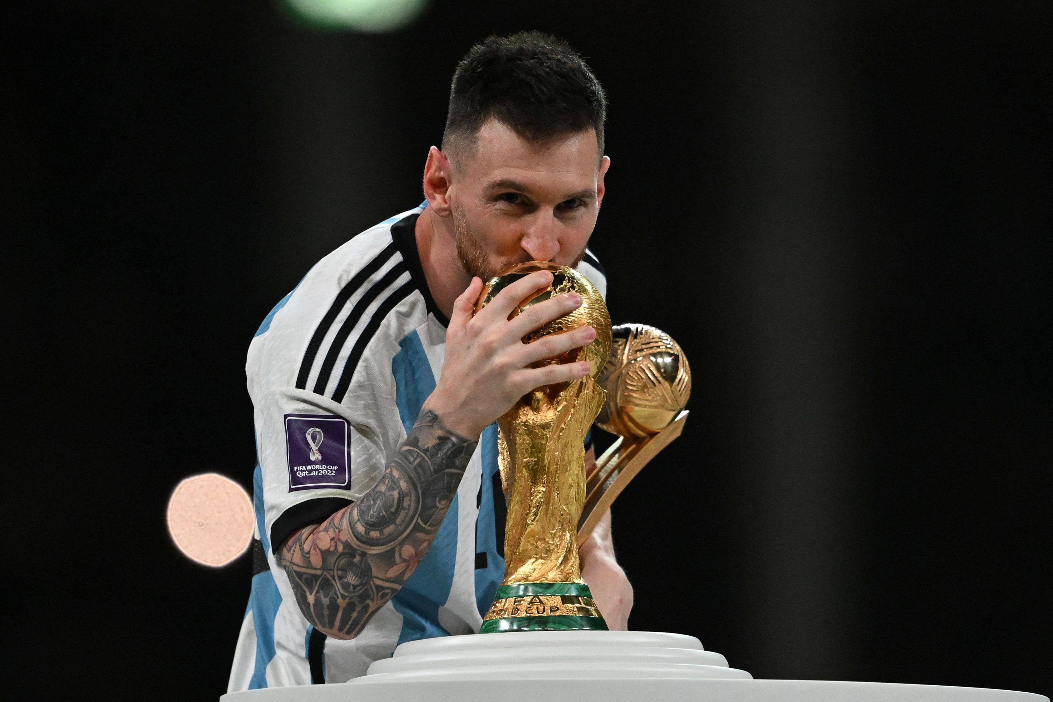 Argentina’s Lionel Messi kisses the Fifa World Cup after the 2022 final in Qatar. Photo: AFP
