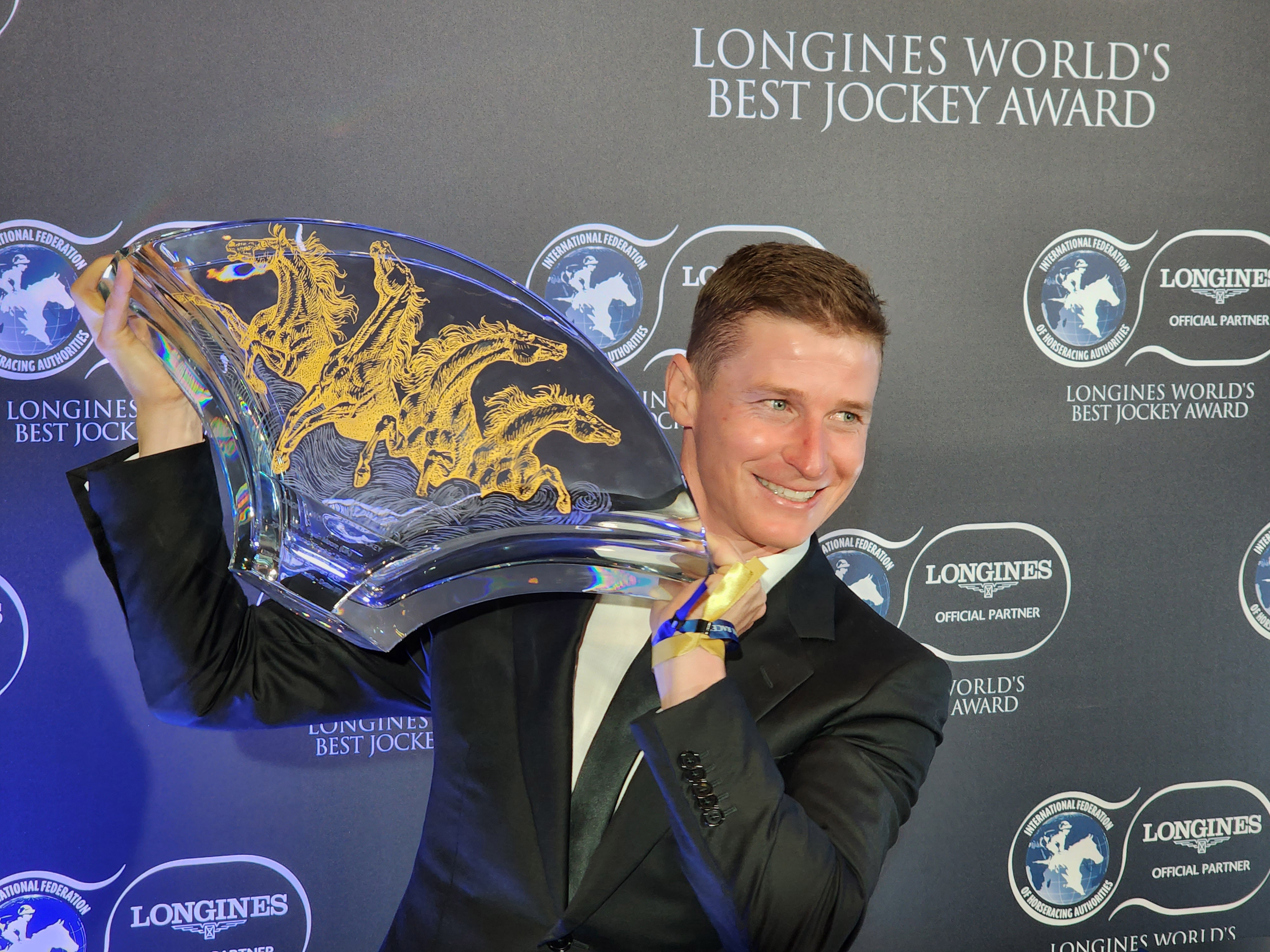 James McDonald receives the 2022 Longines World’s Best Jockey Award at the Hong Kong Convention and Exhibition Centre on December 9. Photo: Kenneth Chan