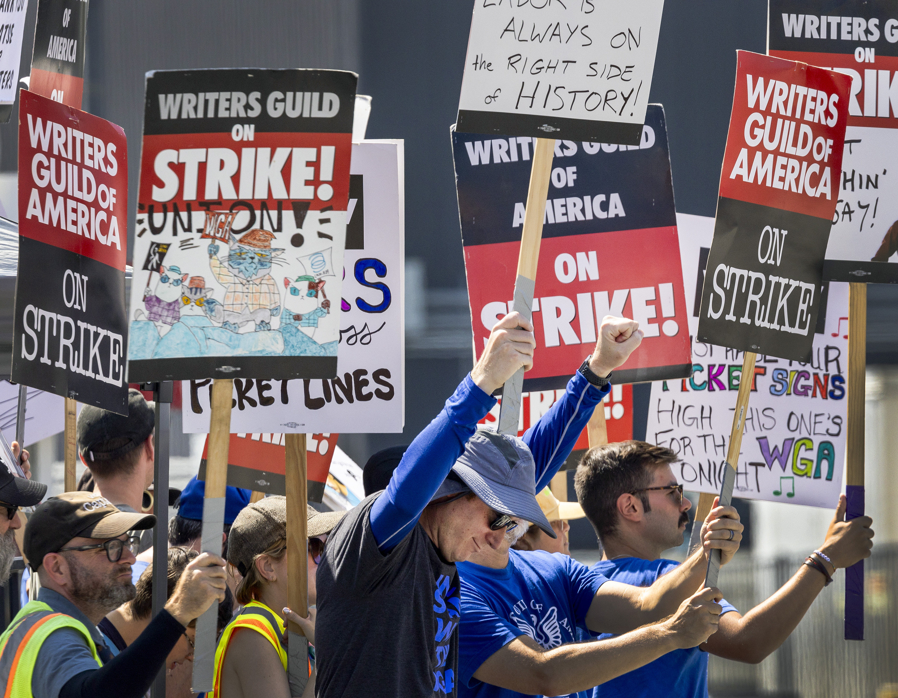 Members of the Writers Guild of America picket in front of CBS Television City in Los Angeles on September 24. With a growing number of jobs threatened by AI automation, entrepreneurial education and workers possessing a variety of skills are more important than ever. Photo: TNS