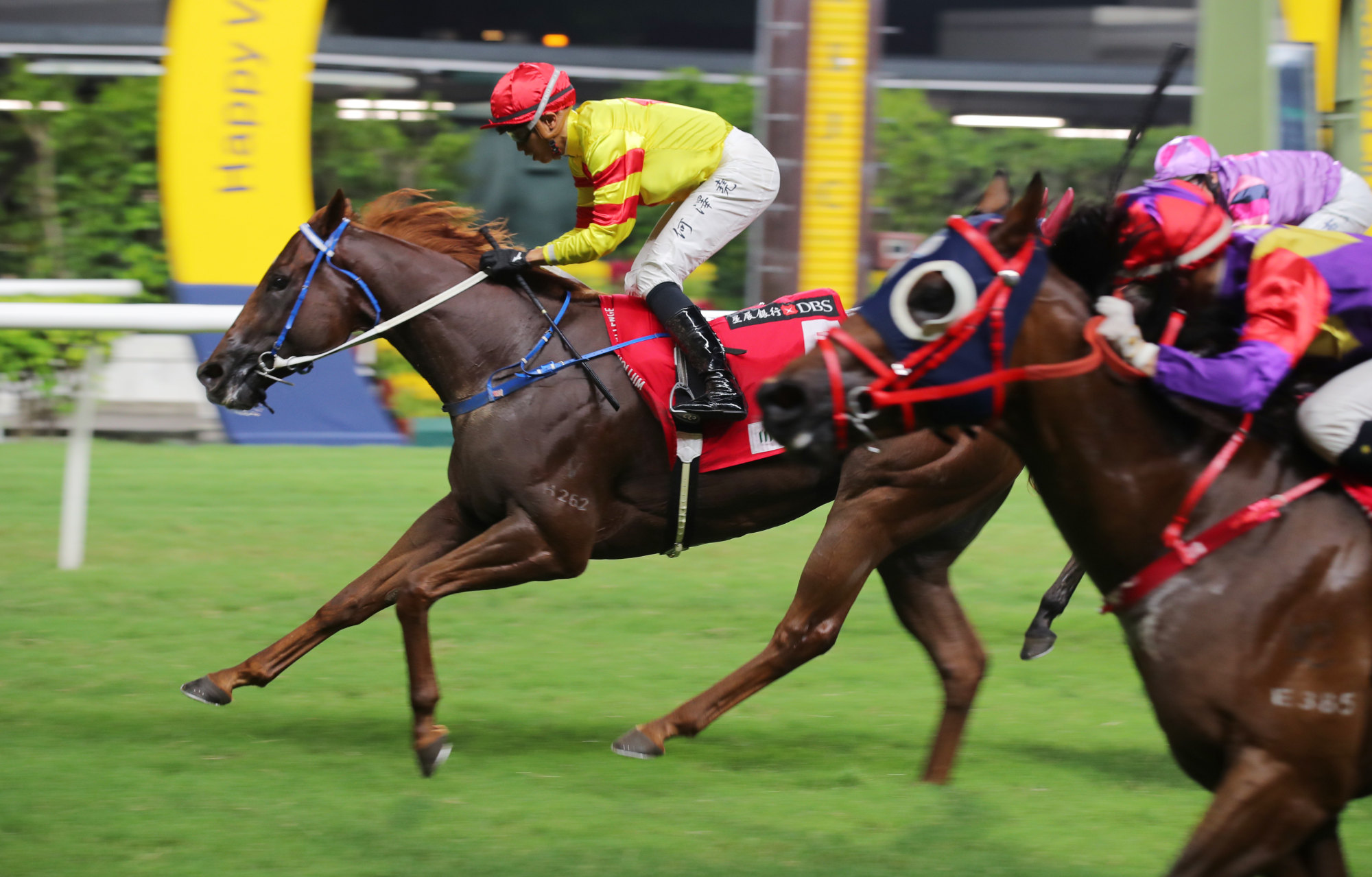 Vincent Ho crosses the line aboard Capital Delight at Happy Valley on Wednesday night.