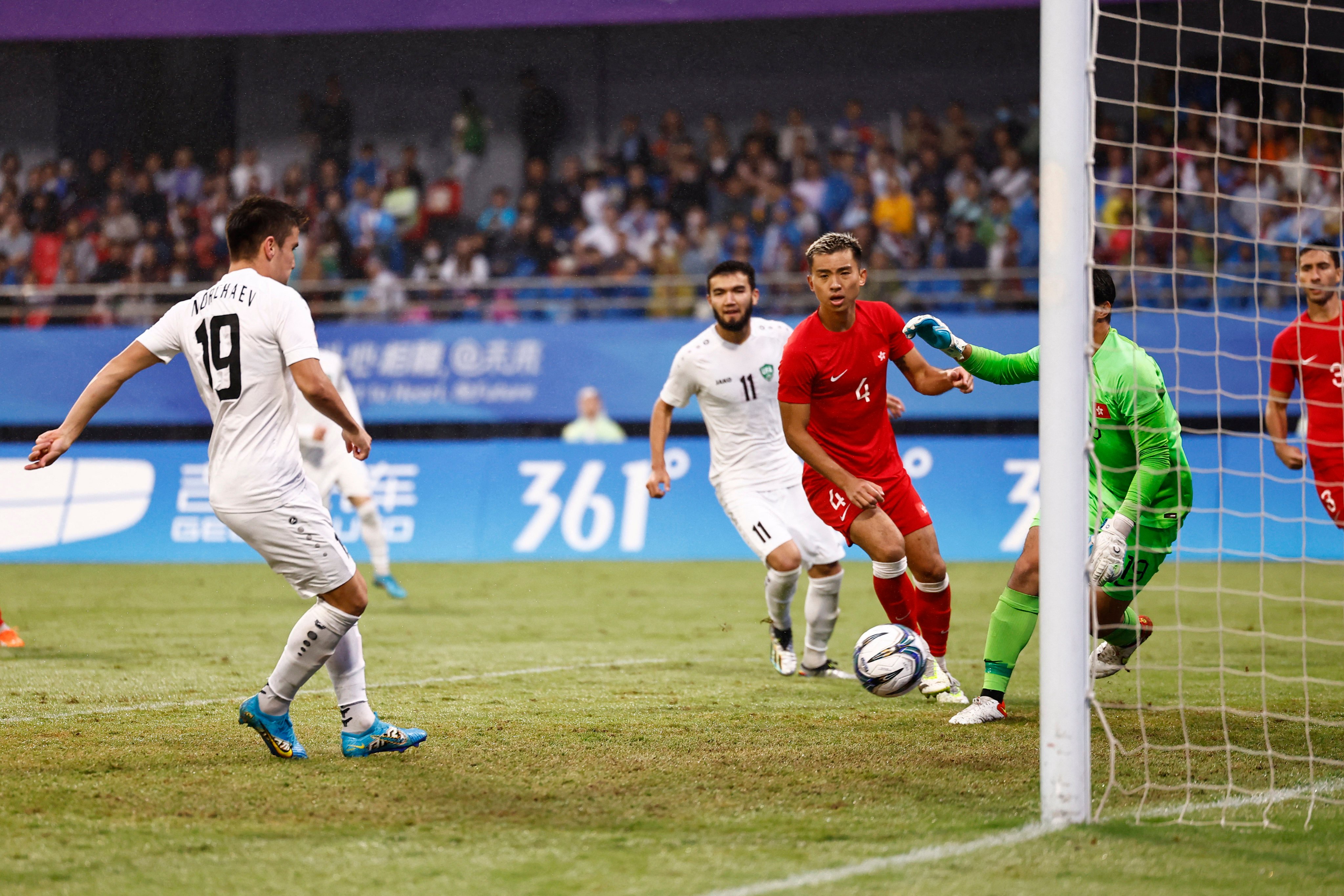 Uzbekistan’s Khusain Norchaev scores their second goal against Hong Kong. Photo: Reuters