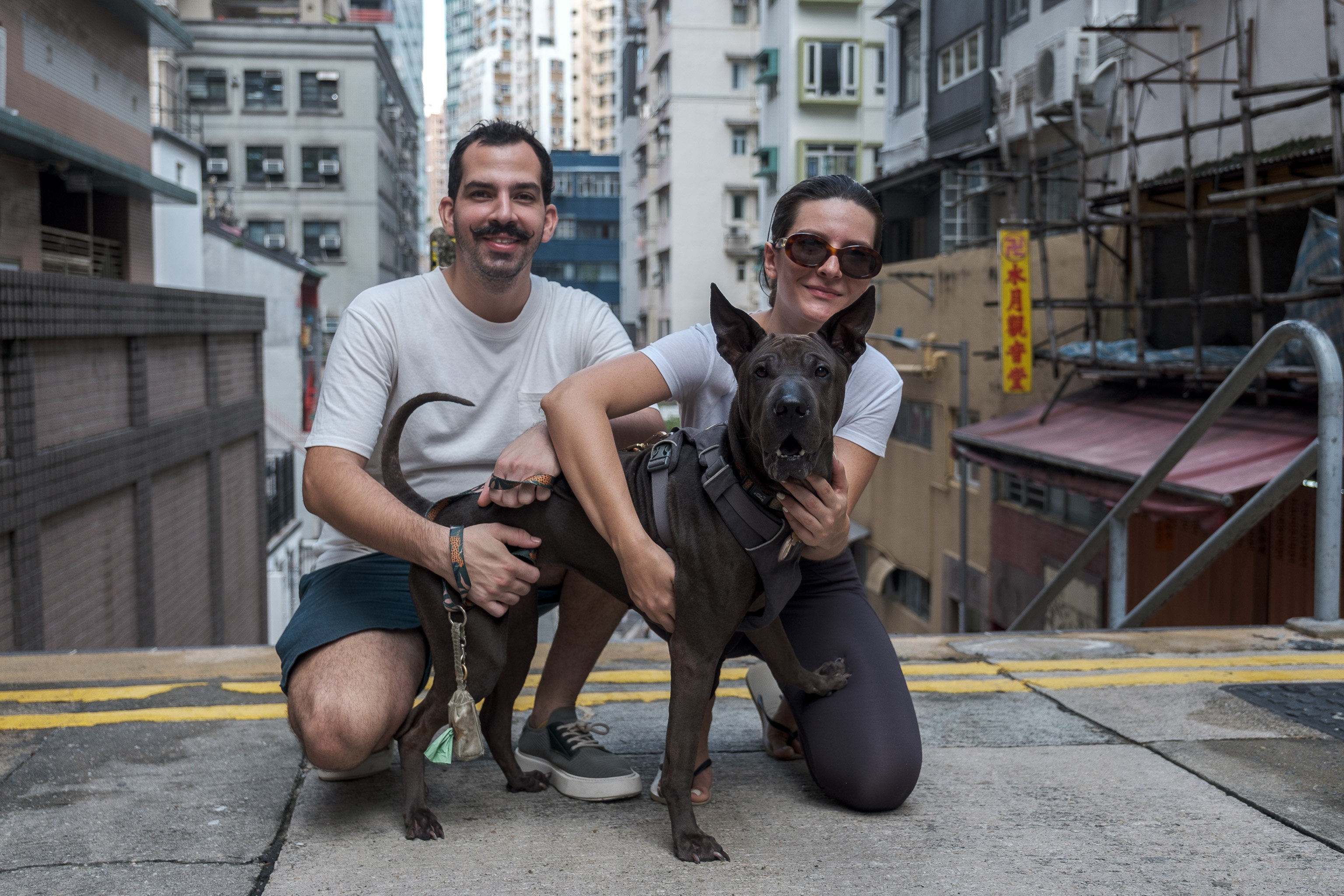 Brazilian Laura Ponturl (right) says bringing her dog Valentina to work with her would provide a welcome mental-health boost. Photo: Connor Mycroft