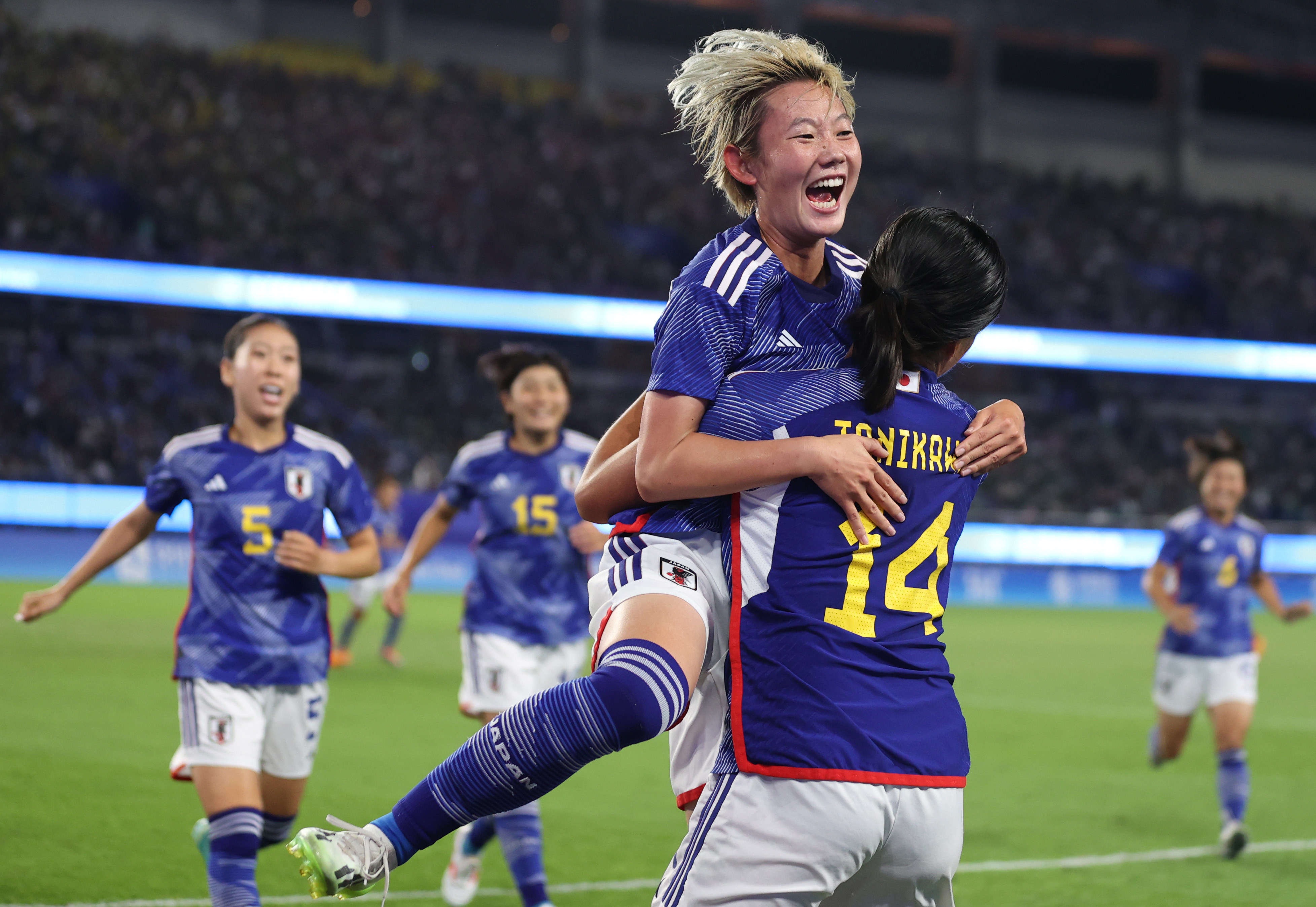 Japan’s Haruka Osawa (left) celebrates scoring against North Korea with Momoko Tanikawa in the final of the women’s football at the Asian Games. Photo: Xinhua