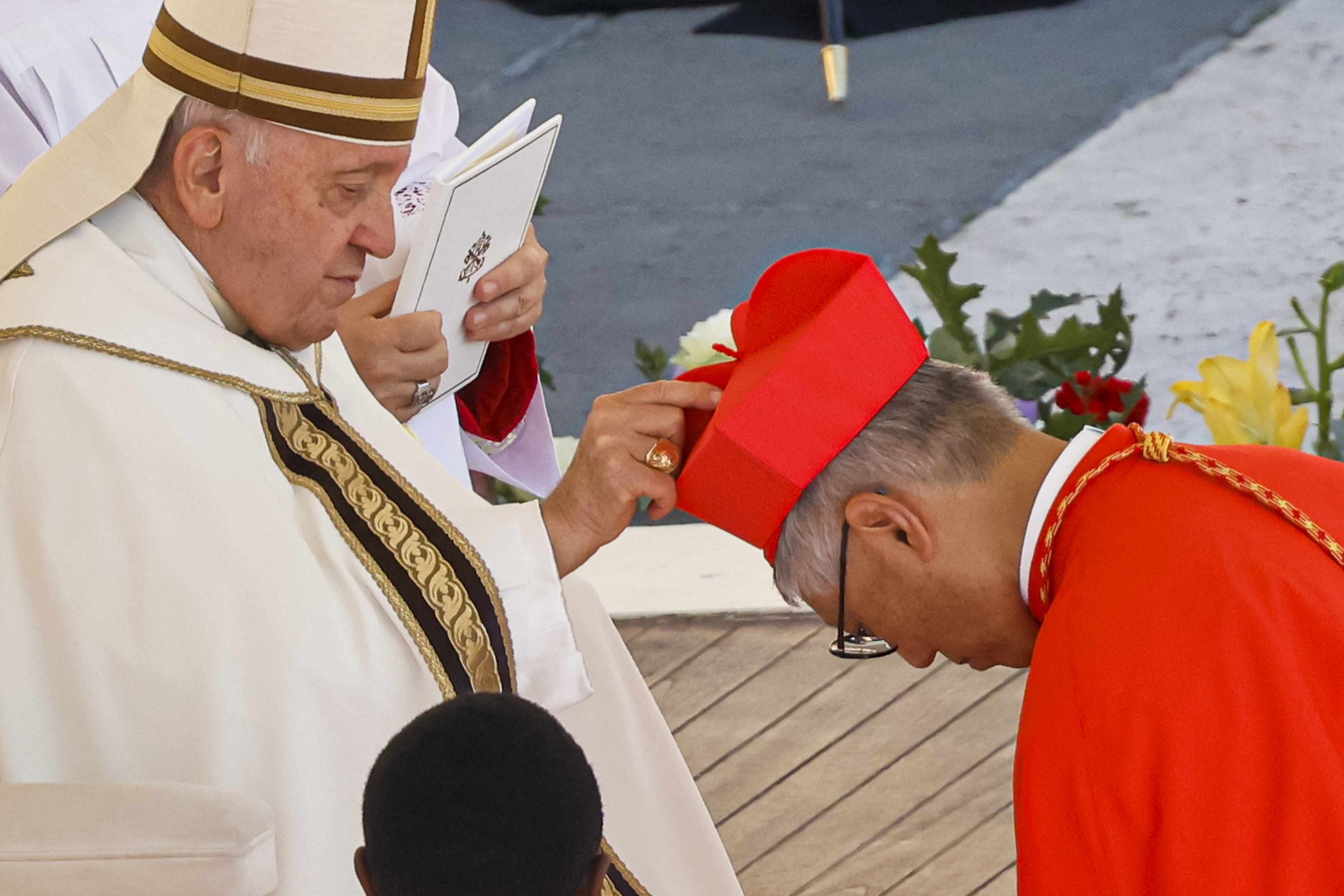 Newly elected Cardinal Stephen Chow, Bishop of Hong Kong (right) receives his biretta from Pope Francis as he is elevated in St. Peter’s Square at The Vatican. Photo: AP