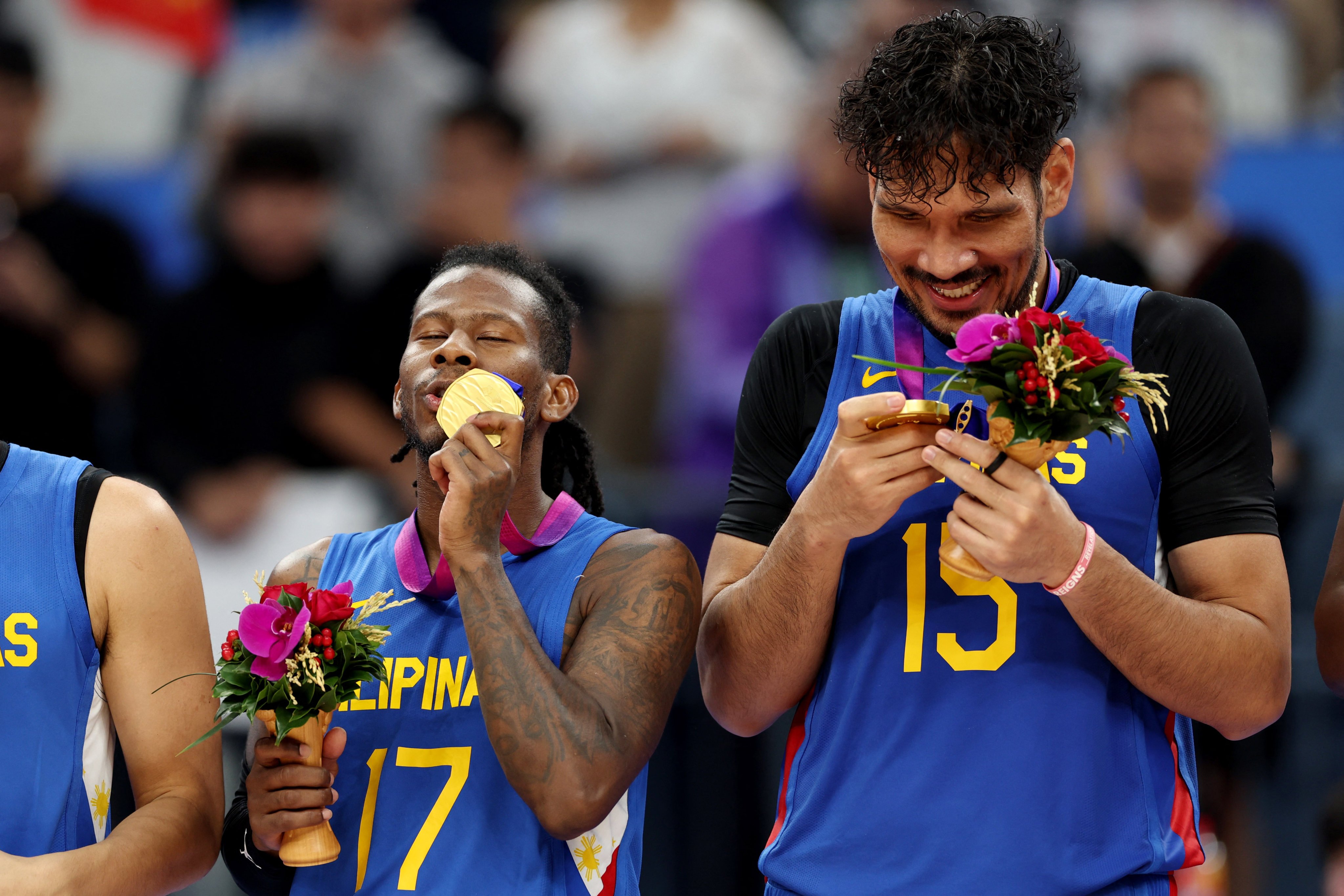 Perez Jaymar (left) and Fajardo Junemar celebrate with their gold medals after tje Philippines beat Jordan in the men’s basketball final at the Hangzhou Asian Games. Photo: Reuters
