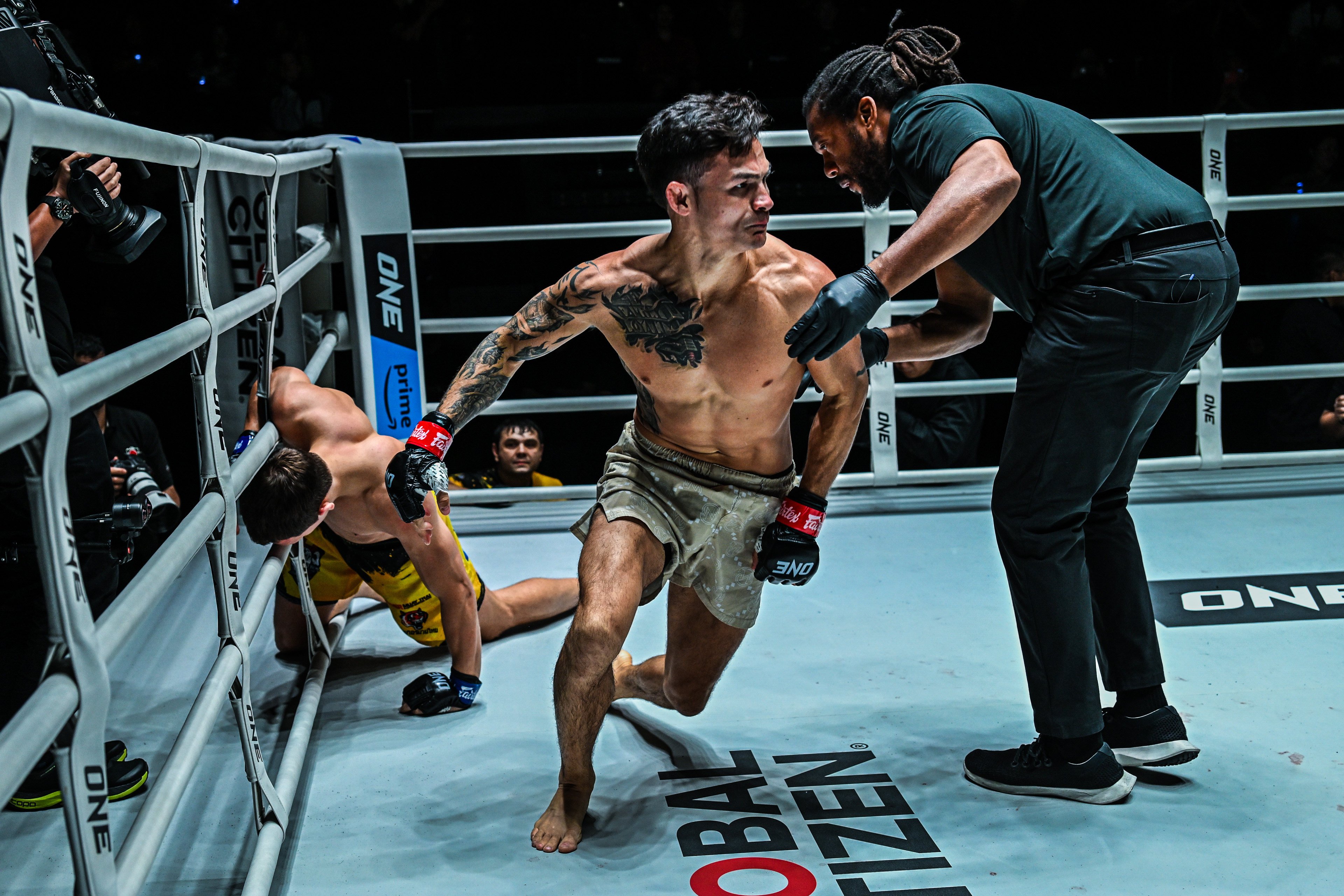 Thanh Le charges off to celebrate after submitting Ilya Freymanov with a leg lock. Photos: ONE Championship