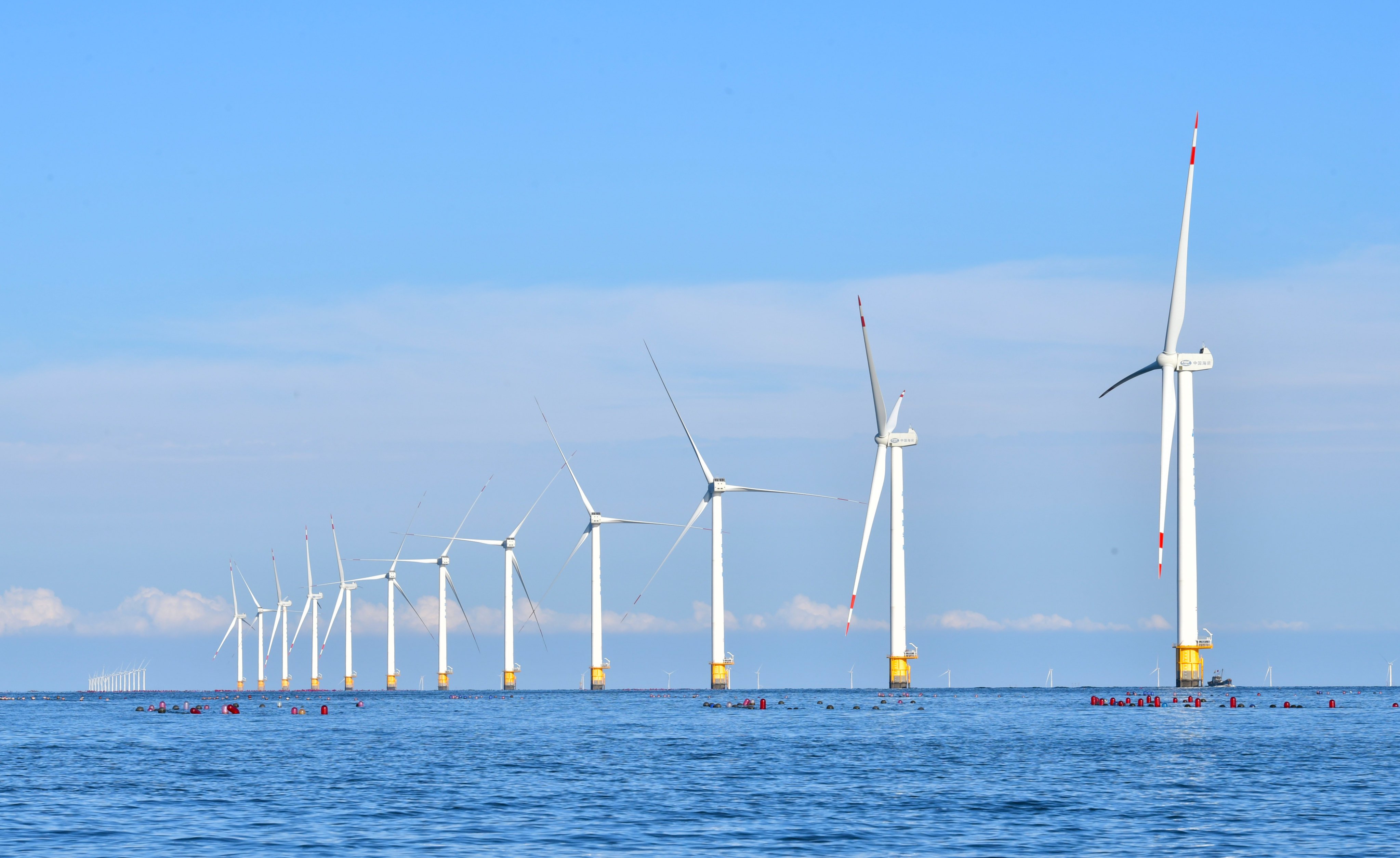 An offshore wind farm is seen in Dalian, Liaoning province, on September 13. Under a planned economy like China’s, policymakers can focus on social priorities such as infrastructure and channel savings directly into these areas. Photo: Xinhua 