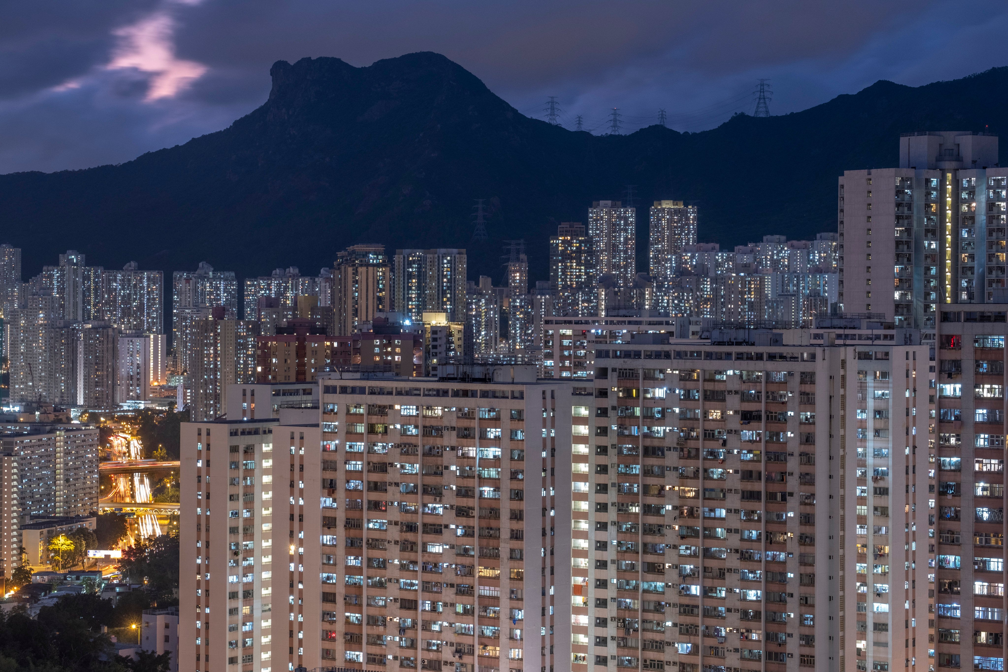 Lion Rock looms over the night skyline in Kowloon. Photo: Sun Yeung