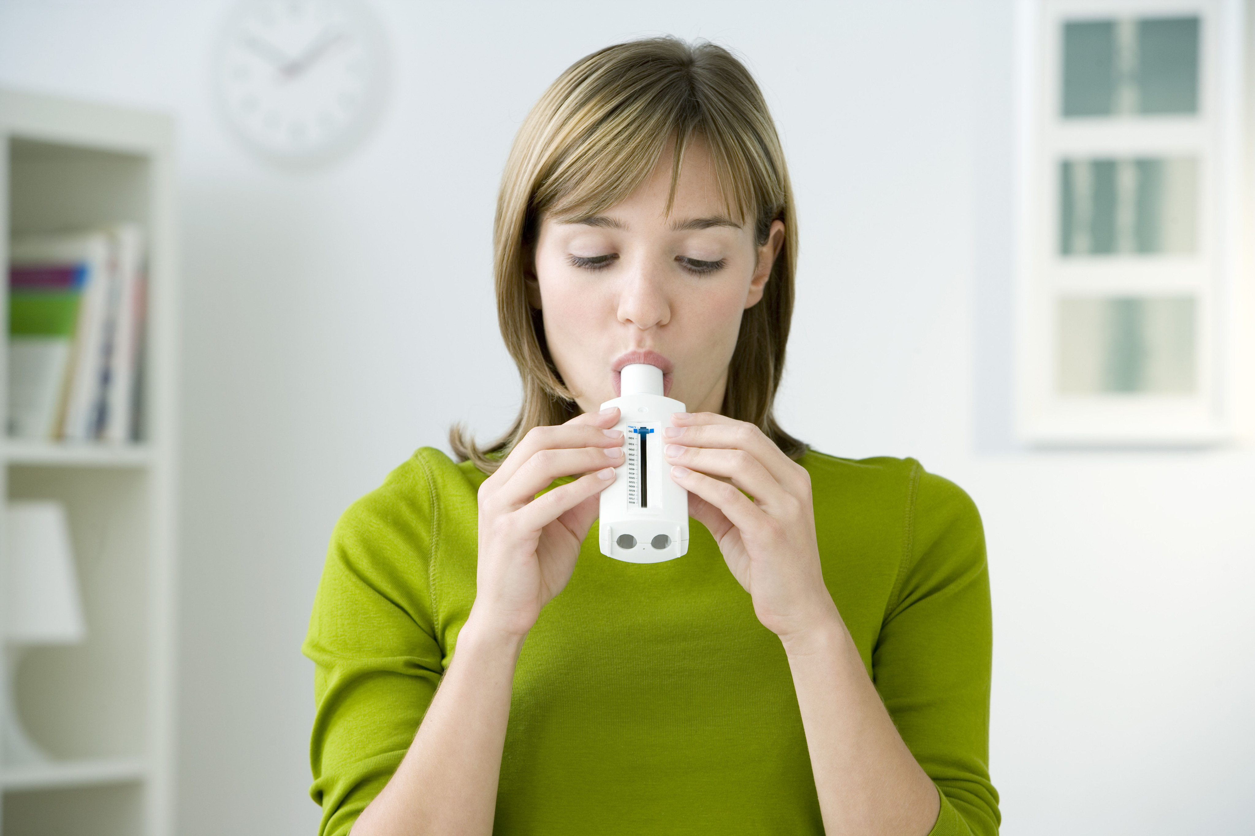 A Woman woman exhales into a device. Vivek Wadhwa, an entrepreneur and academic who is well known in Silicon Valley, has been working on a longshot project to detect cancer in people using only their breath – similar to using a breathalyser.&#xA;&#xA;Credit: Shutterstock
