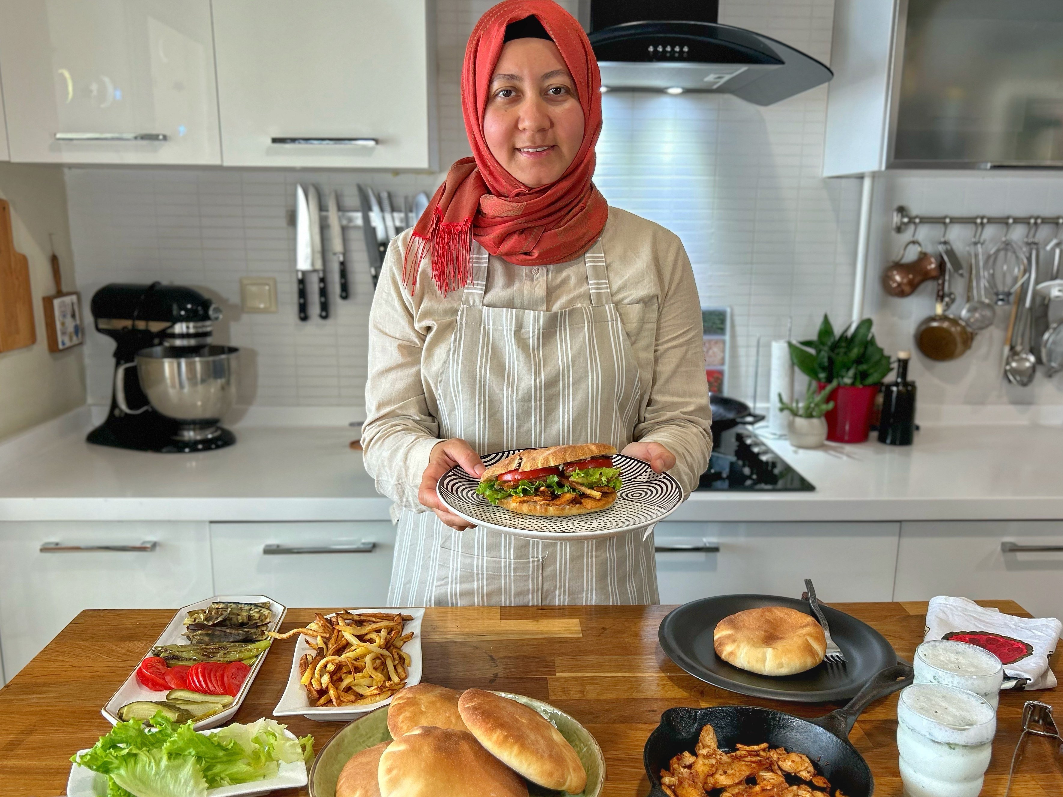 Aysenur Altan at her home in Istanbul preparing food. Altan’s English-language YouTube channel, Turkish Food Travel, reveals Turkey to the world. Photo: courtesy Aysenur Altan