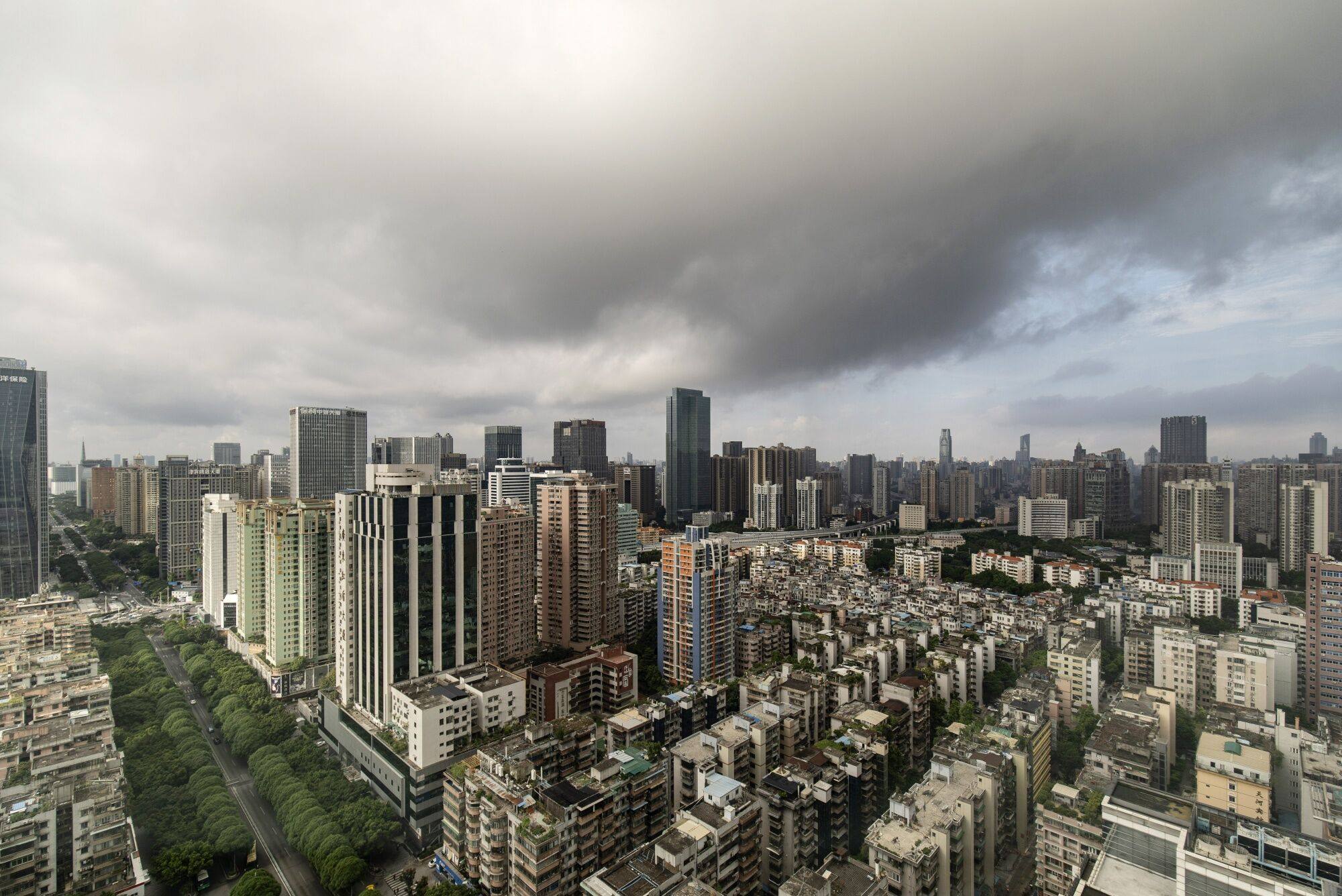 A view of downtown Guangzhou, seen on August 22. China’s property sector burdens, from falling sales to eroding values, are straining developers’ refinancing efforts, and a spillover to the broader economy is inevitable. Photo: Bloomberg