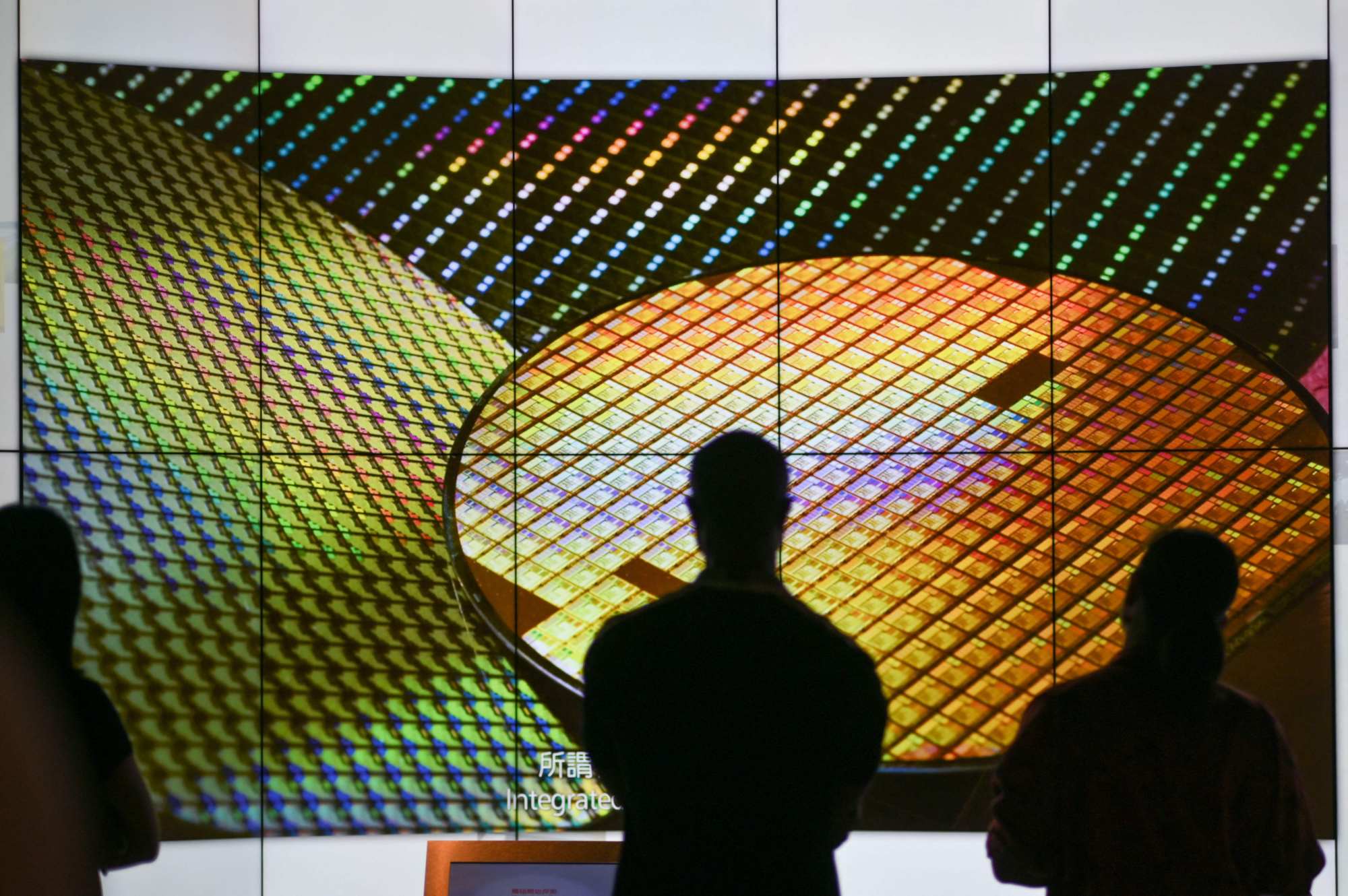 Silicon wafer images are displayed at the Taiwan Semiconductor Manufacturing Co museum in Hsinchu Science Park, July 5, 2023. Photo: AFP