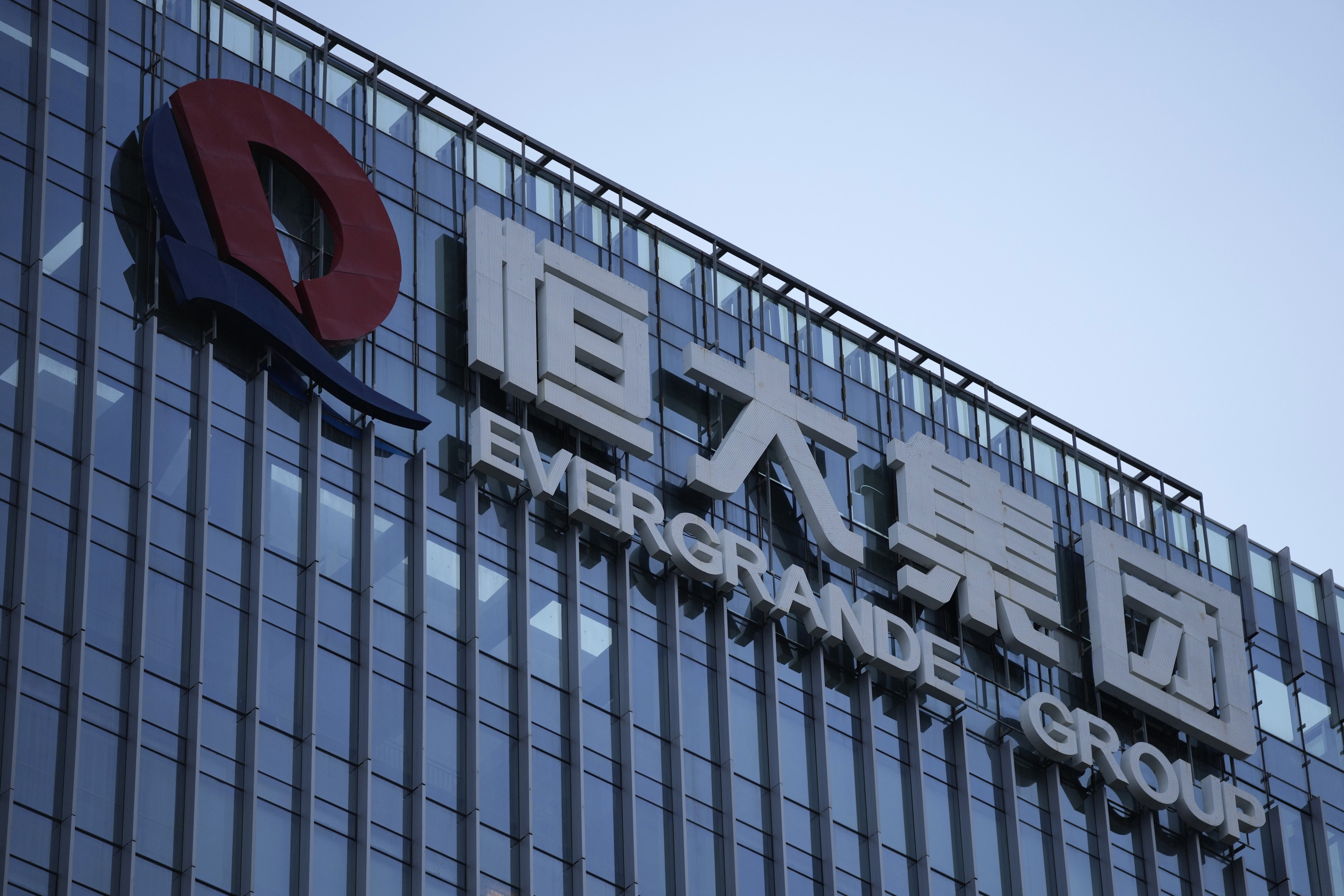 The Evergrande Group logo is seen atop its office building in Shenzhen in September 2021. Photo: AP