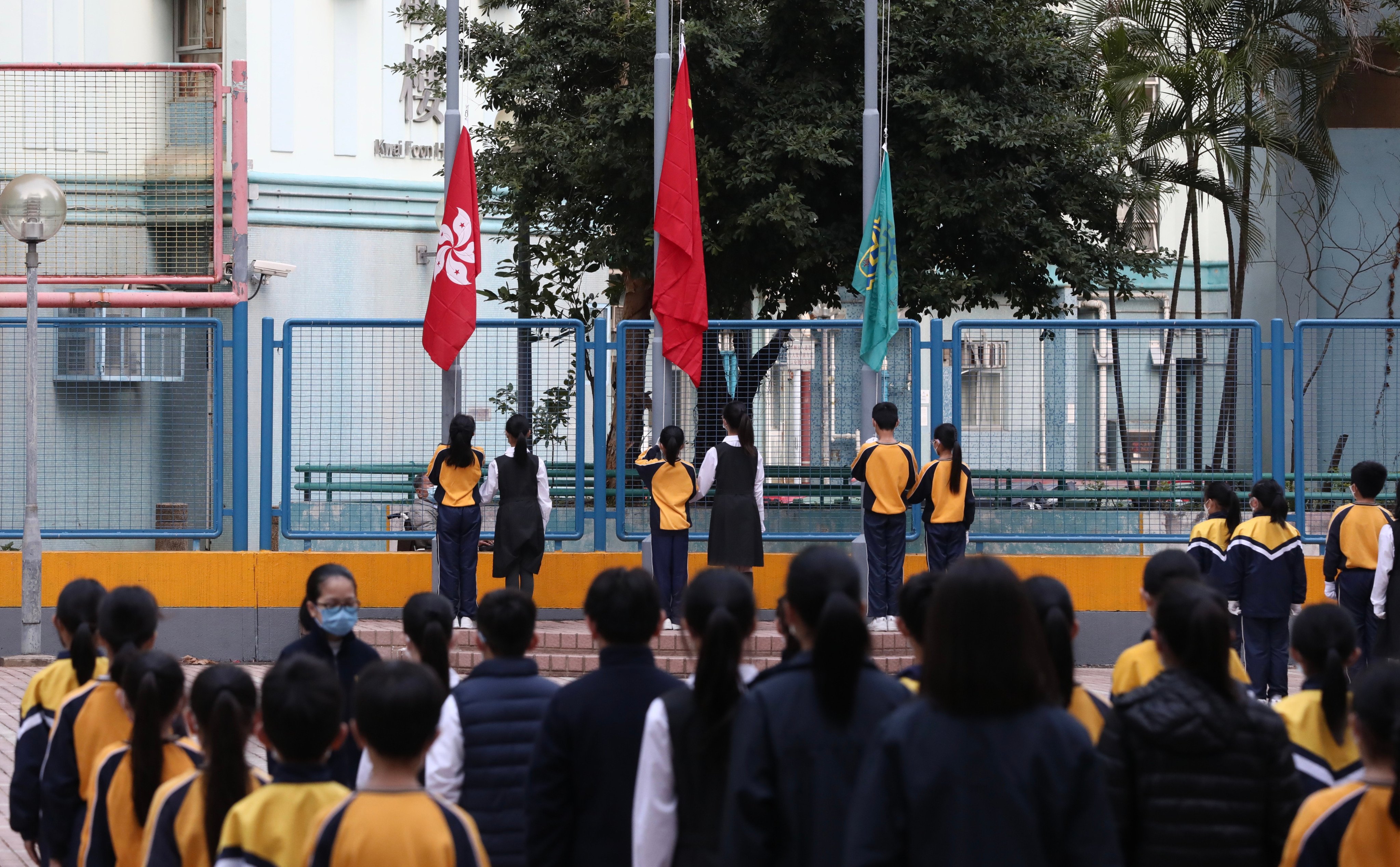 Students take part in a flag-raising ceremony at a school run by a Buddhist organisation in Kwai Fong on January 3, 2022. Photo: Jonathan Wong