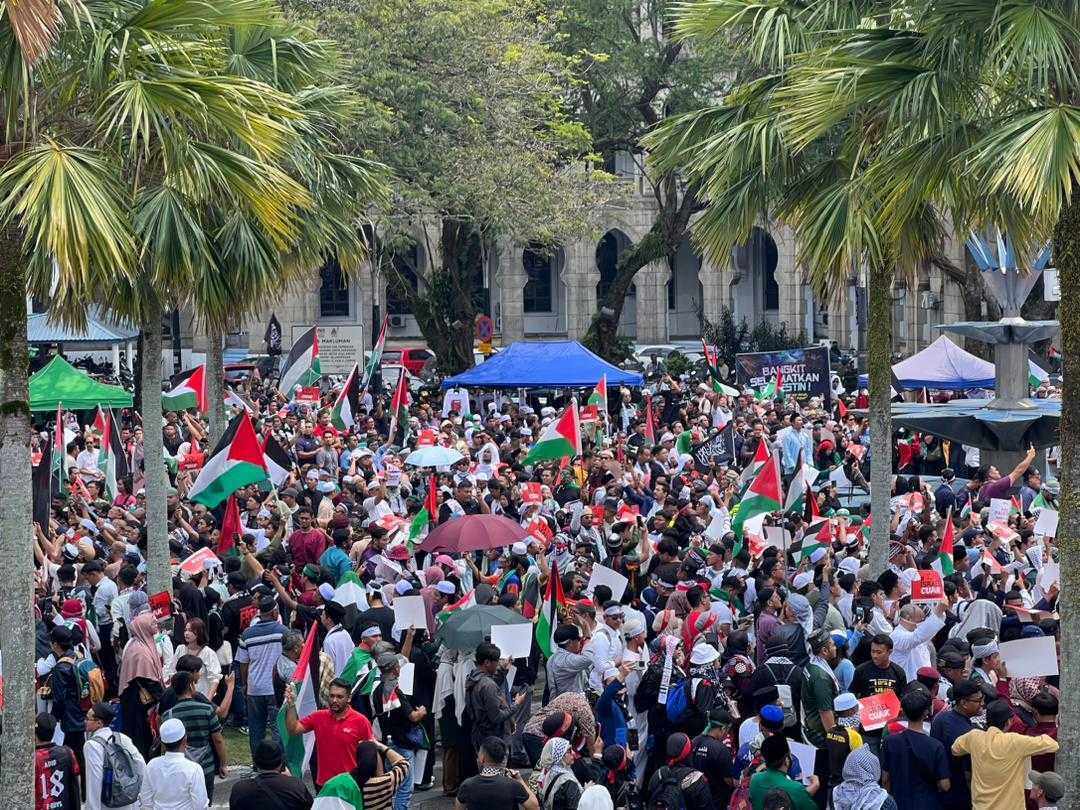 Malaysian Muslims denounce Israel’s military action in Gaza during a rally outside a mosque in Kuala Lumpur on Friday. Photo: Hadi Azmi 