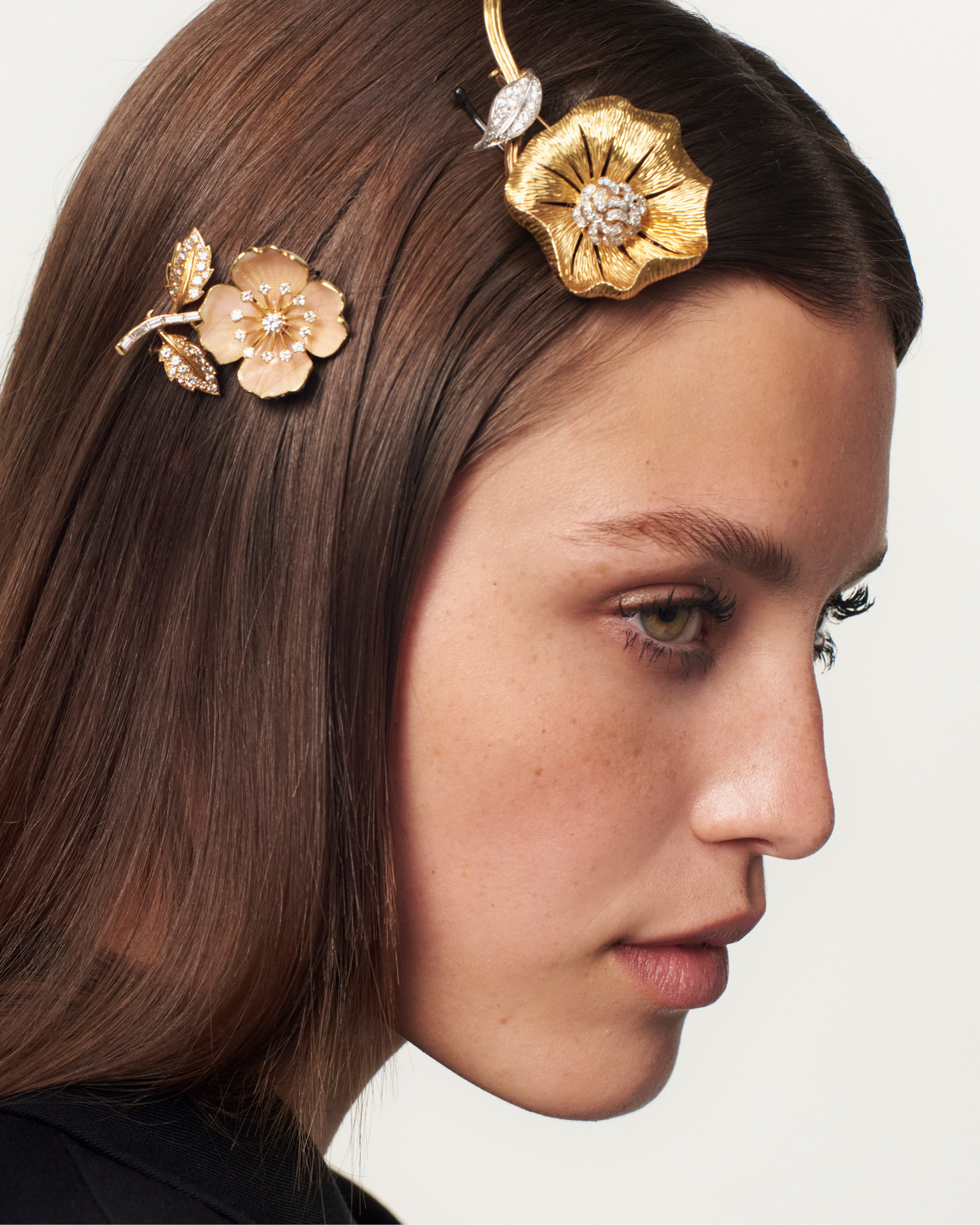 These flower clips date from the 1950s when they were worn on jacket lapels. Today, 70 years on, they are being repurposed as hair jewellery, part of widening trend. Photo: Boucheron
