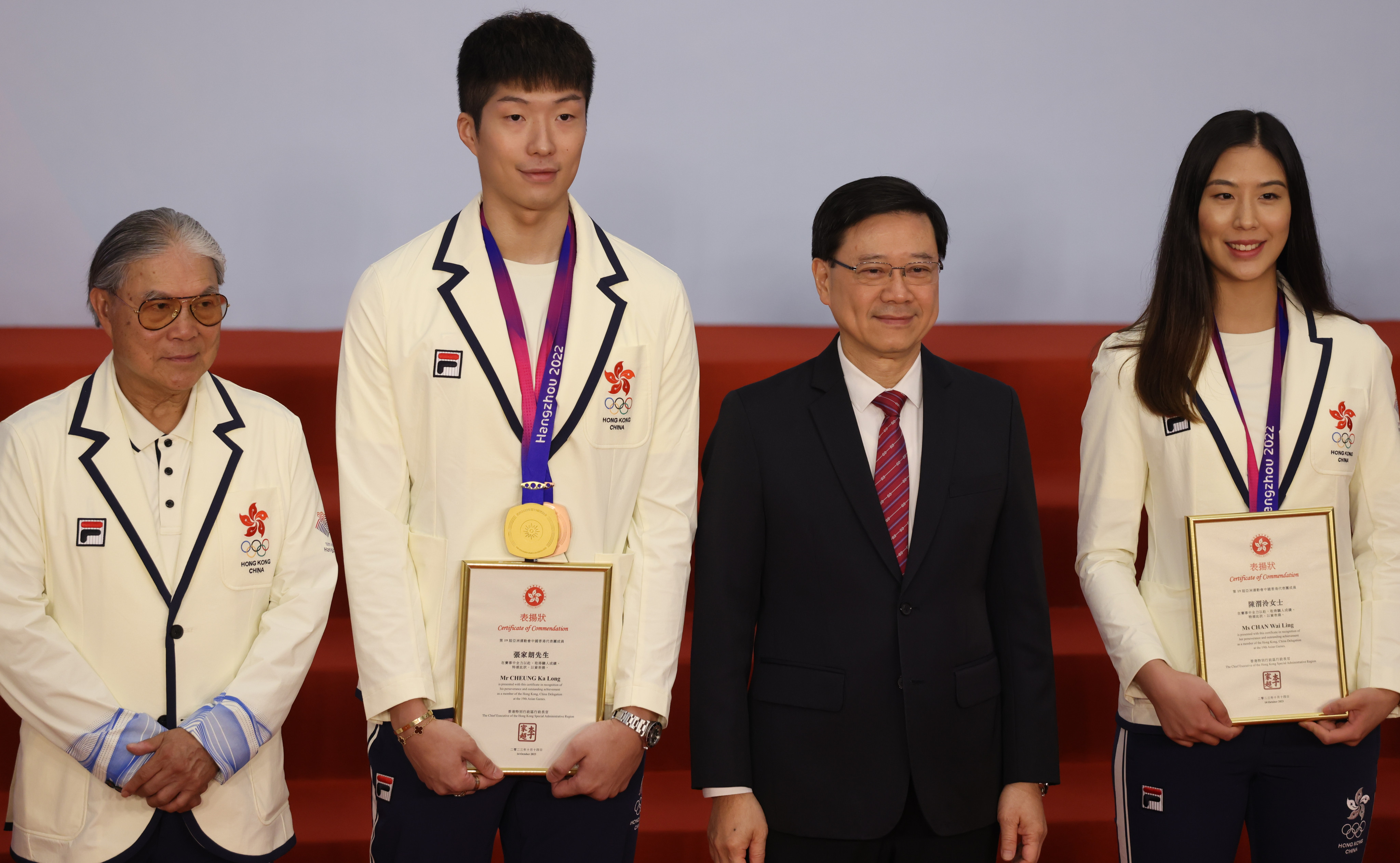 (From left) Timothy Fok of the Olympic Committee, fencer Cheung Ka-long, Hong Kong Chief Executive John Lee and fencer Chan Wai-ling at the reception. Photo: Yik Yeung-man