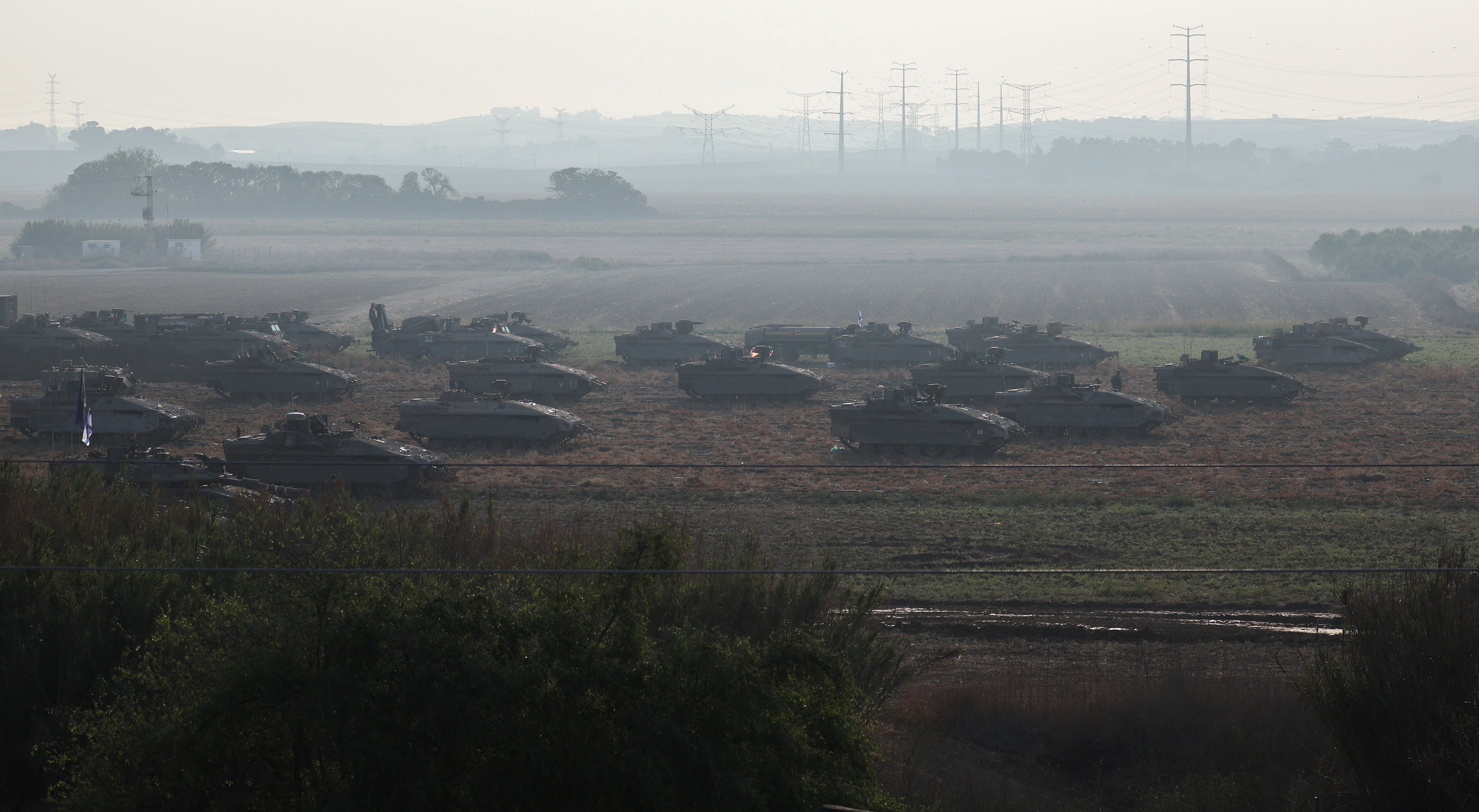 Israeli tanks and military vehicles take position near Israel’s border with the Gaza Strip, in southern Israel. Photo: Reuters