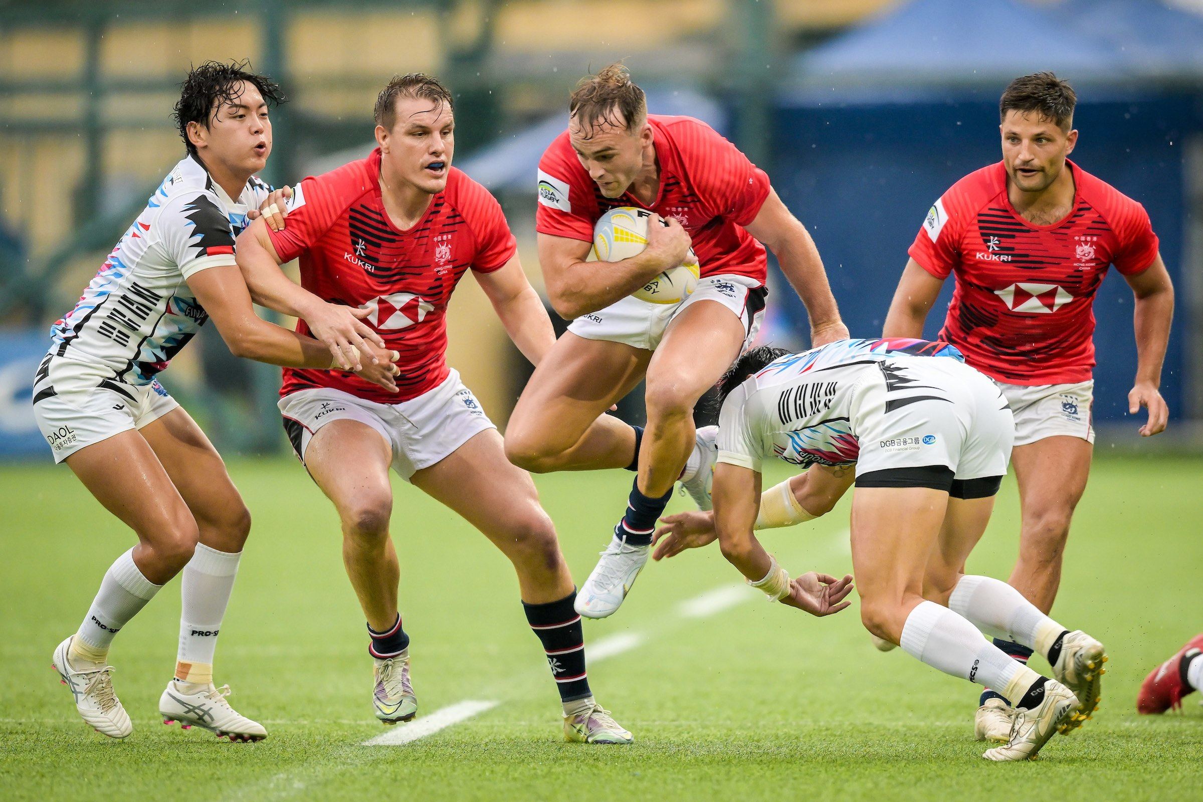 Harry Sayers (centre) helps Hong Kong beat South Korea in June, and he was at it again on Saturday. Photo: HKRU