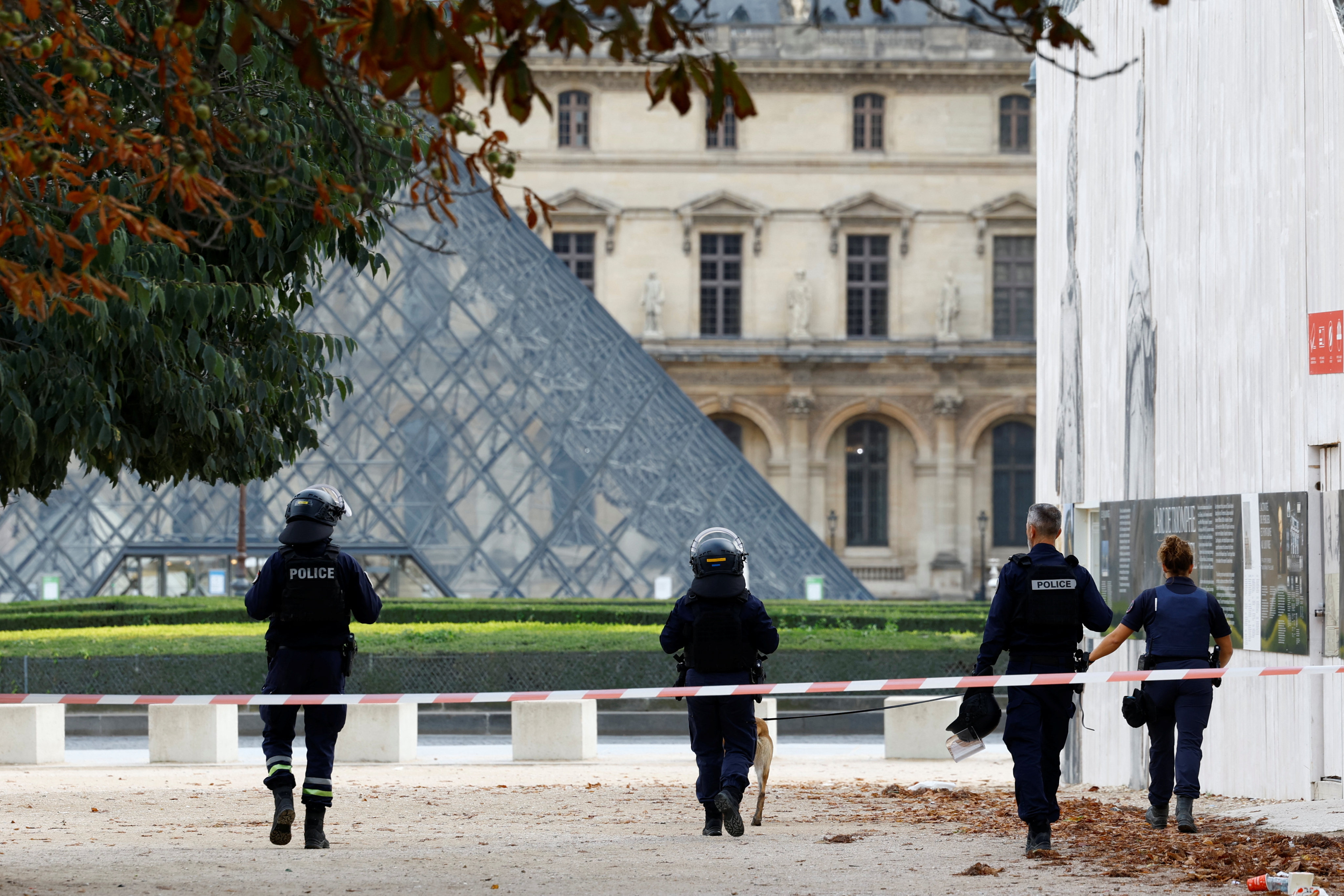French police officers patrol in front of the Louvre Museum, closed for security reasons, in Paris on Saturday. Photo: Reuters
