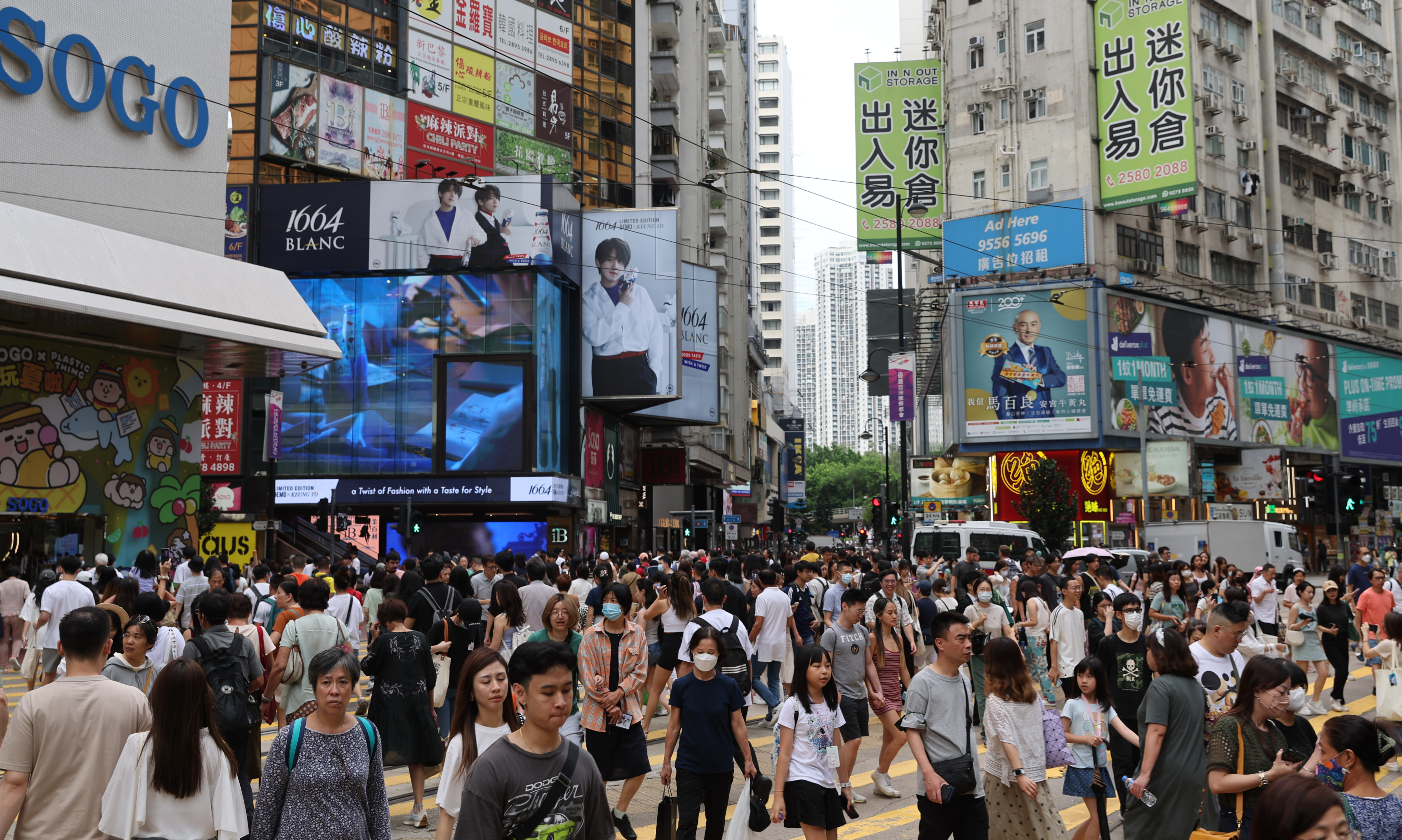 Shoppers on a busy street in Causeway Bay, Hong Kong in July 2023. Photo: Yik Yeung-man