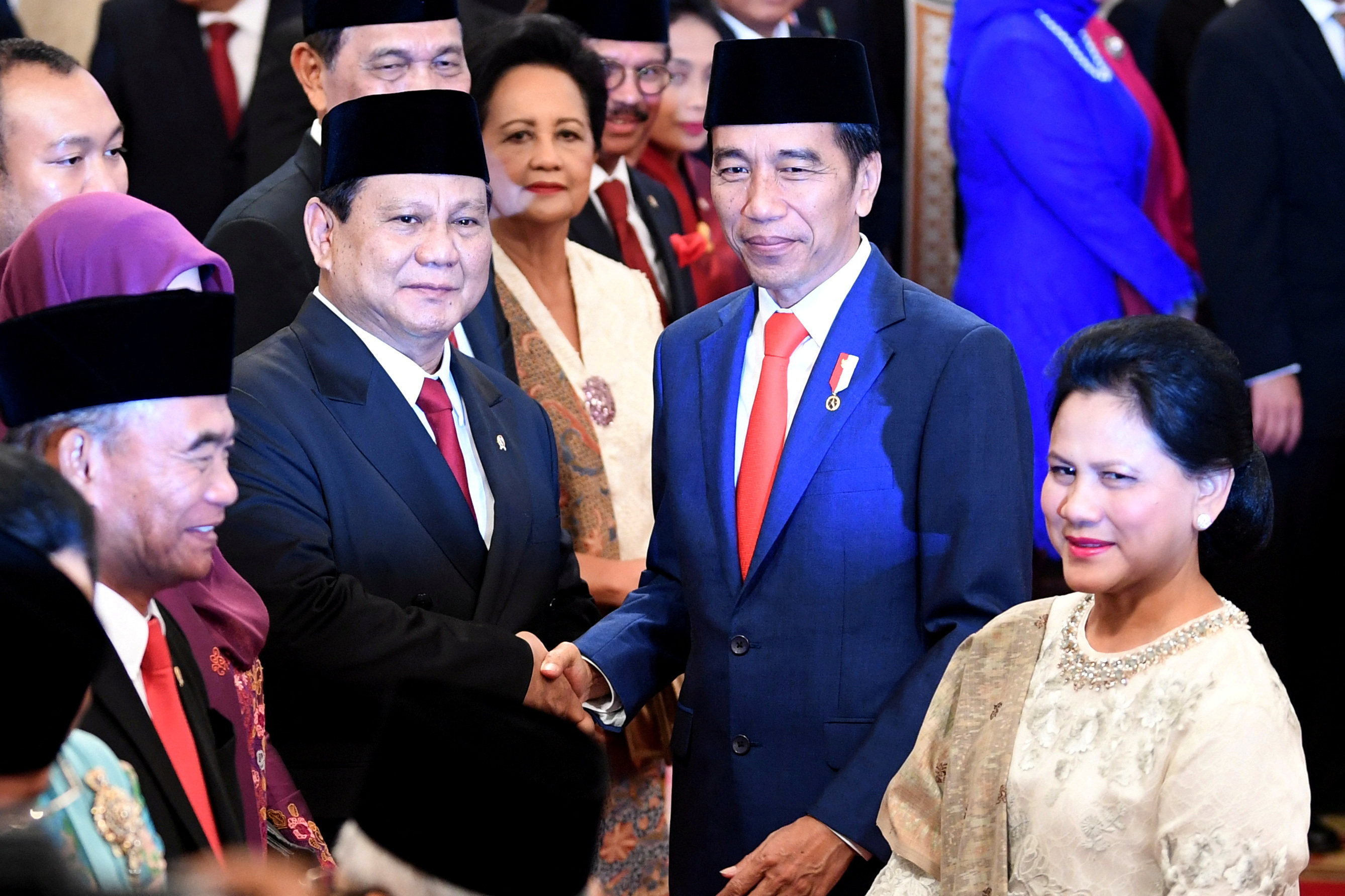 Indonesian Defence Minister Prabowo Subianto shakes hands with President Joko Widodo in 2019 after the former’s swearing-in ceremony. Photo: Antara Foto via Reuters