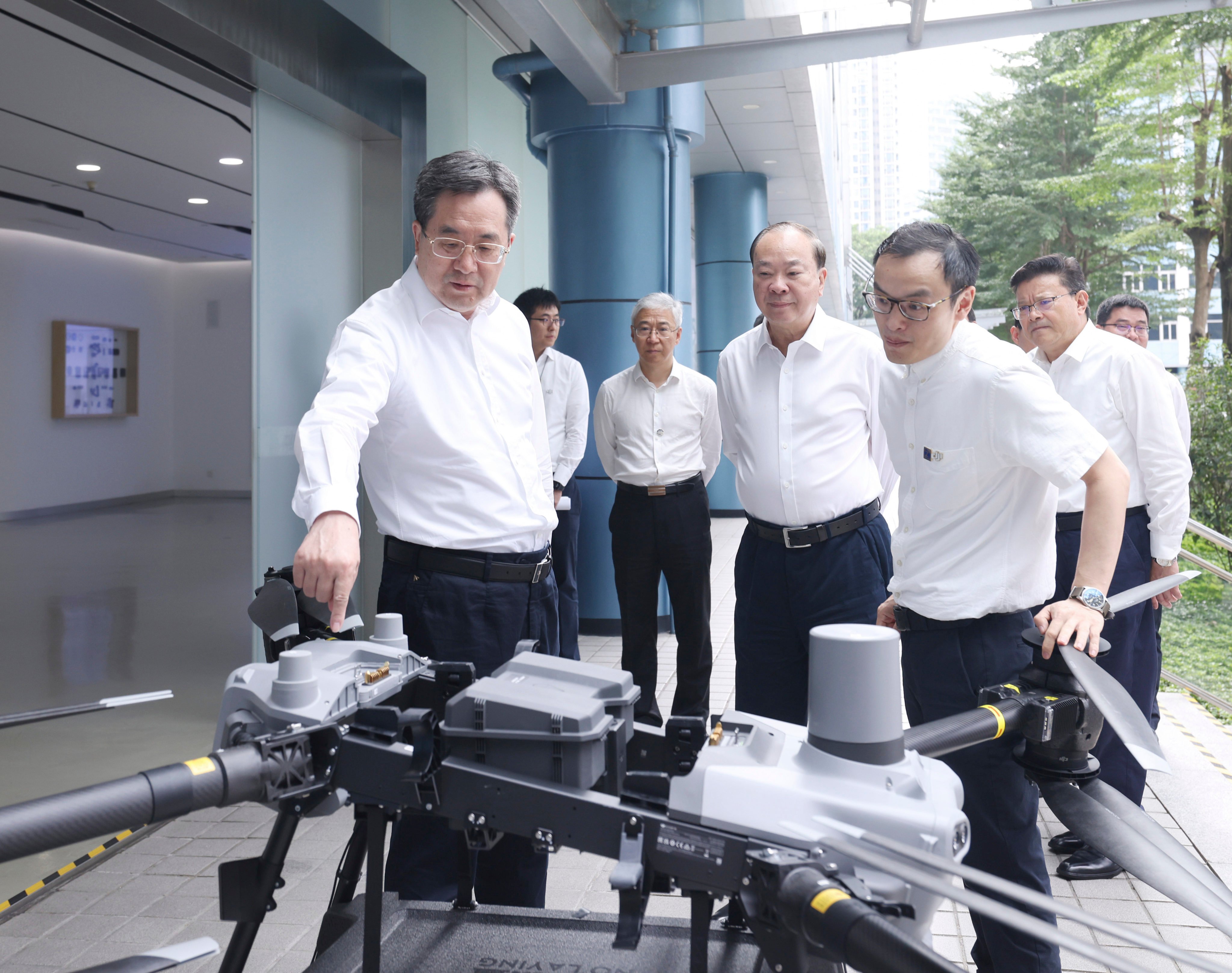 Vice-premier Ding Xuexiang (left) with DJI founder Frank Wang Tao (right) during an inspection tour in Shenzhen. Photo: Xinhua