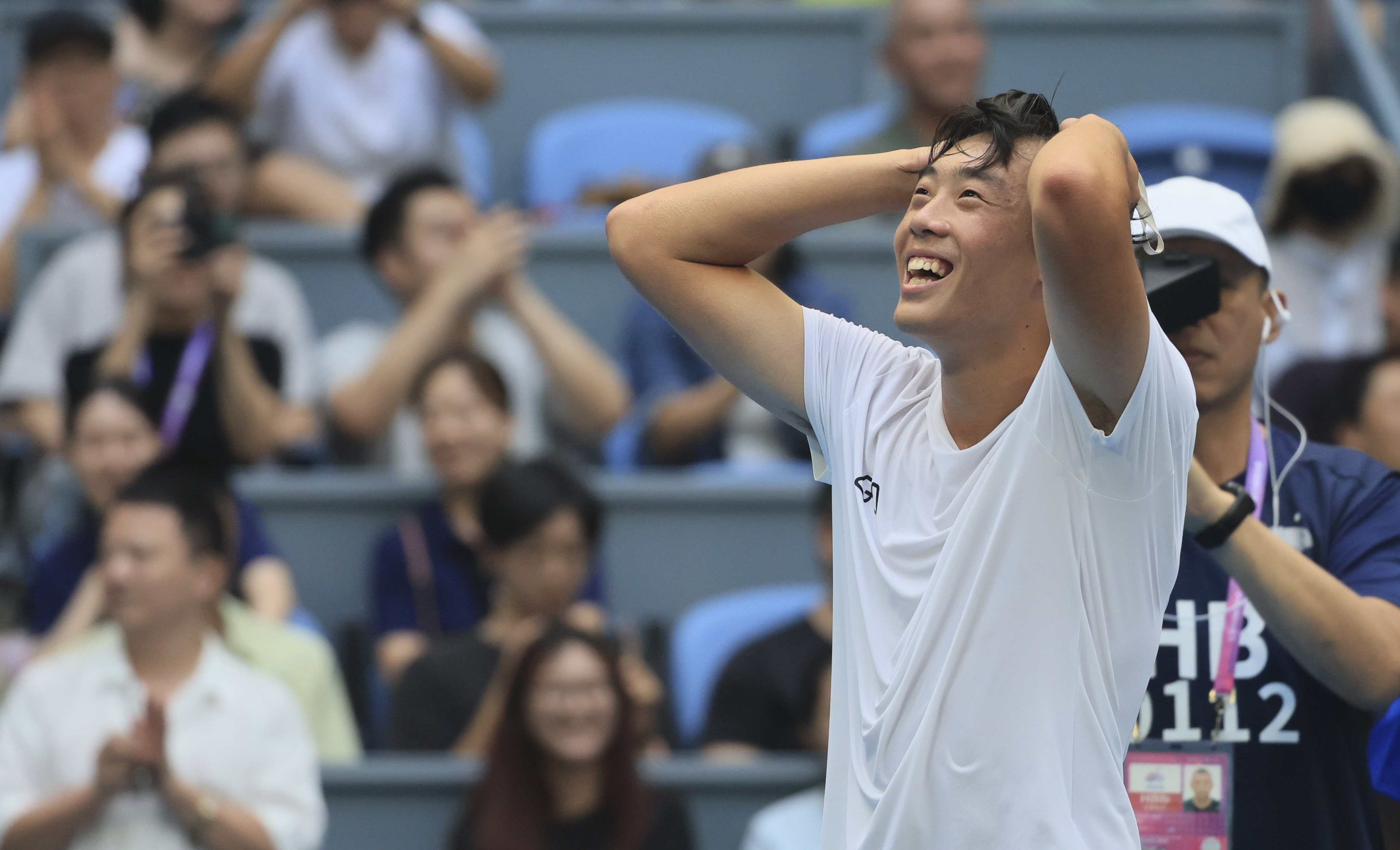 Hong Kong’s Coleman Wong celebrates his win over China’s Wu Yibing at the Asian Games. Photo: Dickson Lee