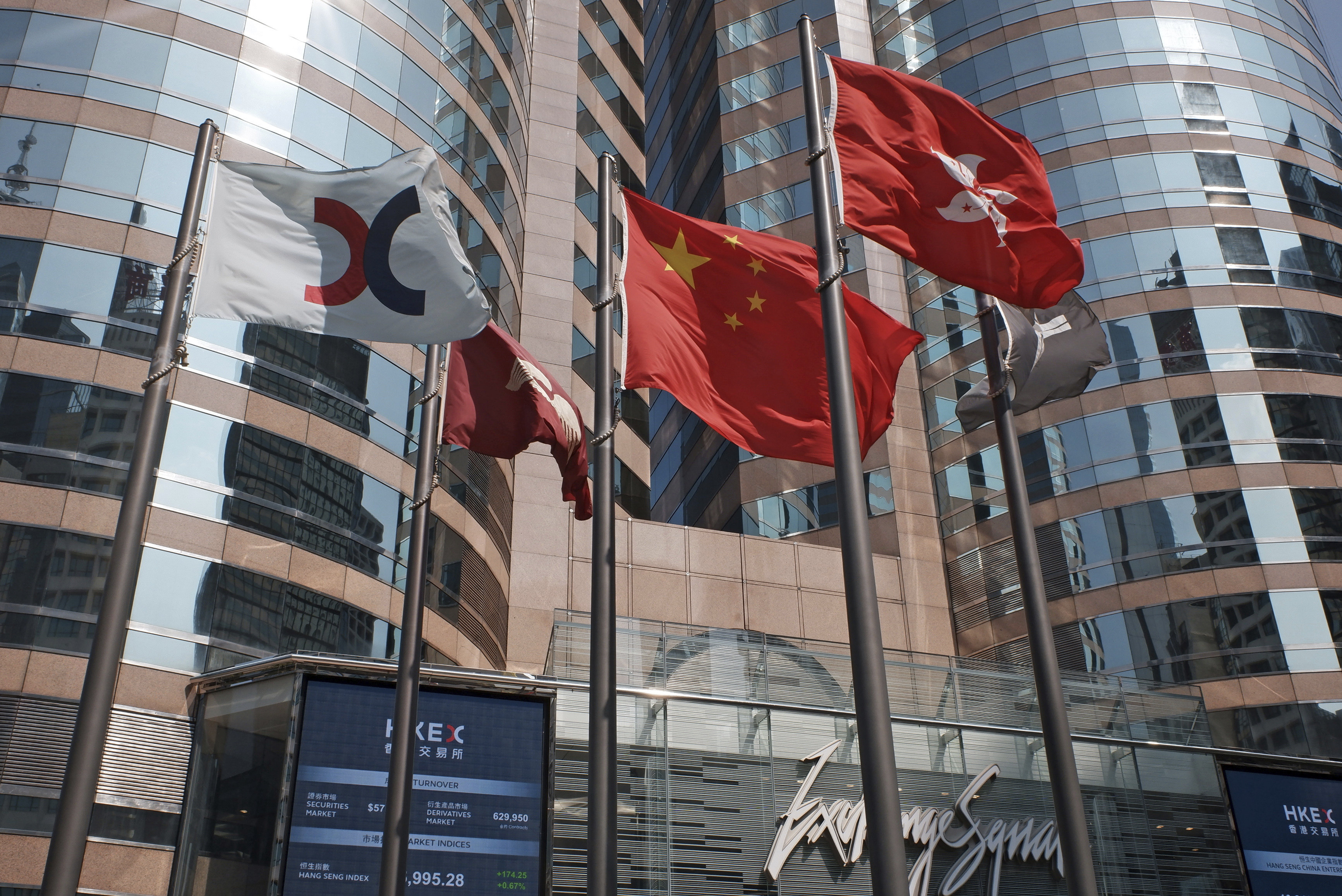 Flags are raised outside the Exchange Square in Central. Hong Kong. Photo: AP