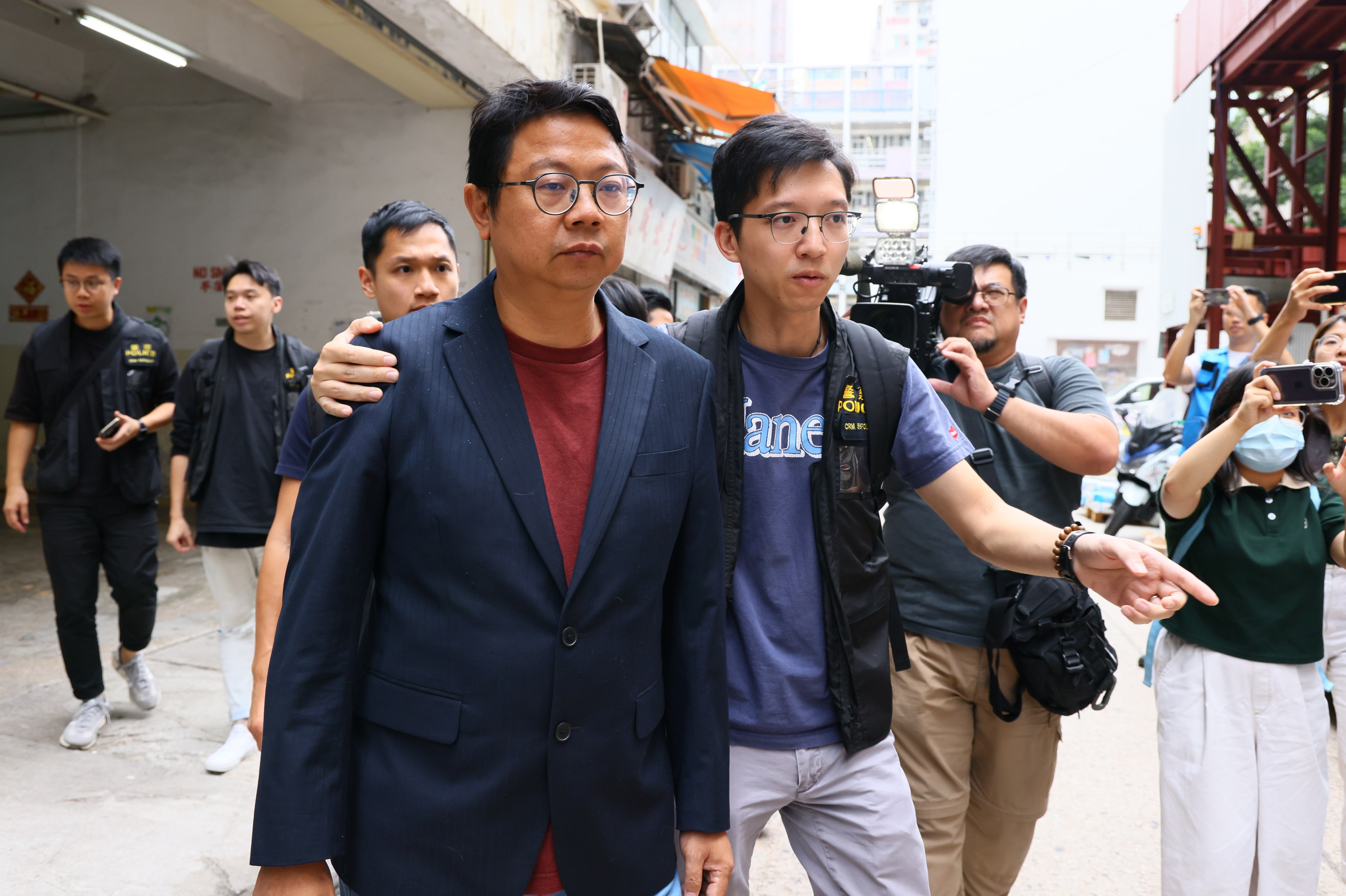 Chu Kong-wai (Left) is accused of promoting MPF schemes without proper registration. Photo: Dickson Lee
