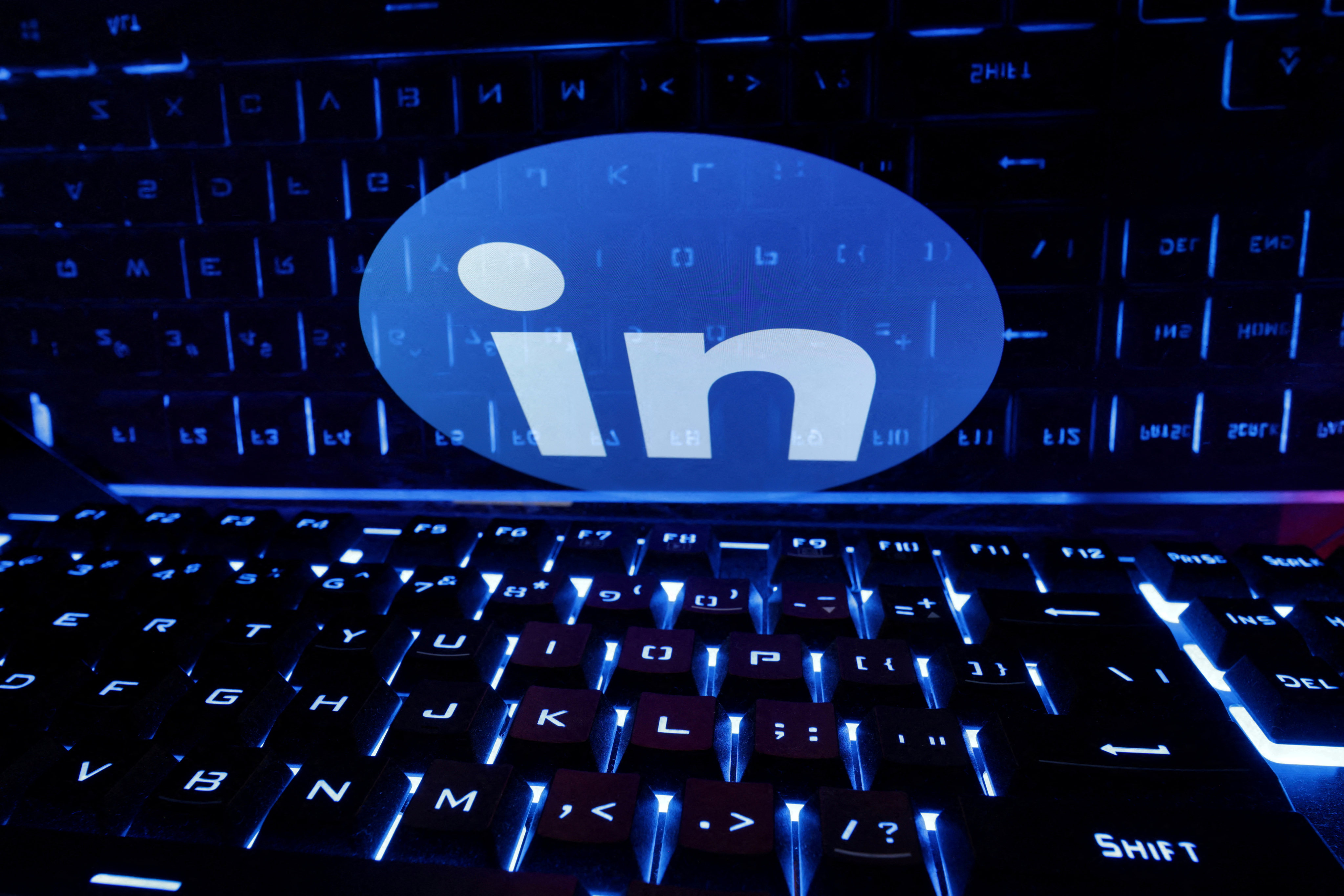A keyboard is placed in front of a displayed LinkedIn logo in this illustration taken February 21, 2023. Photo: Reuters