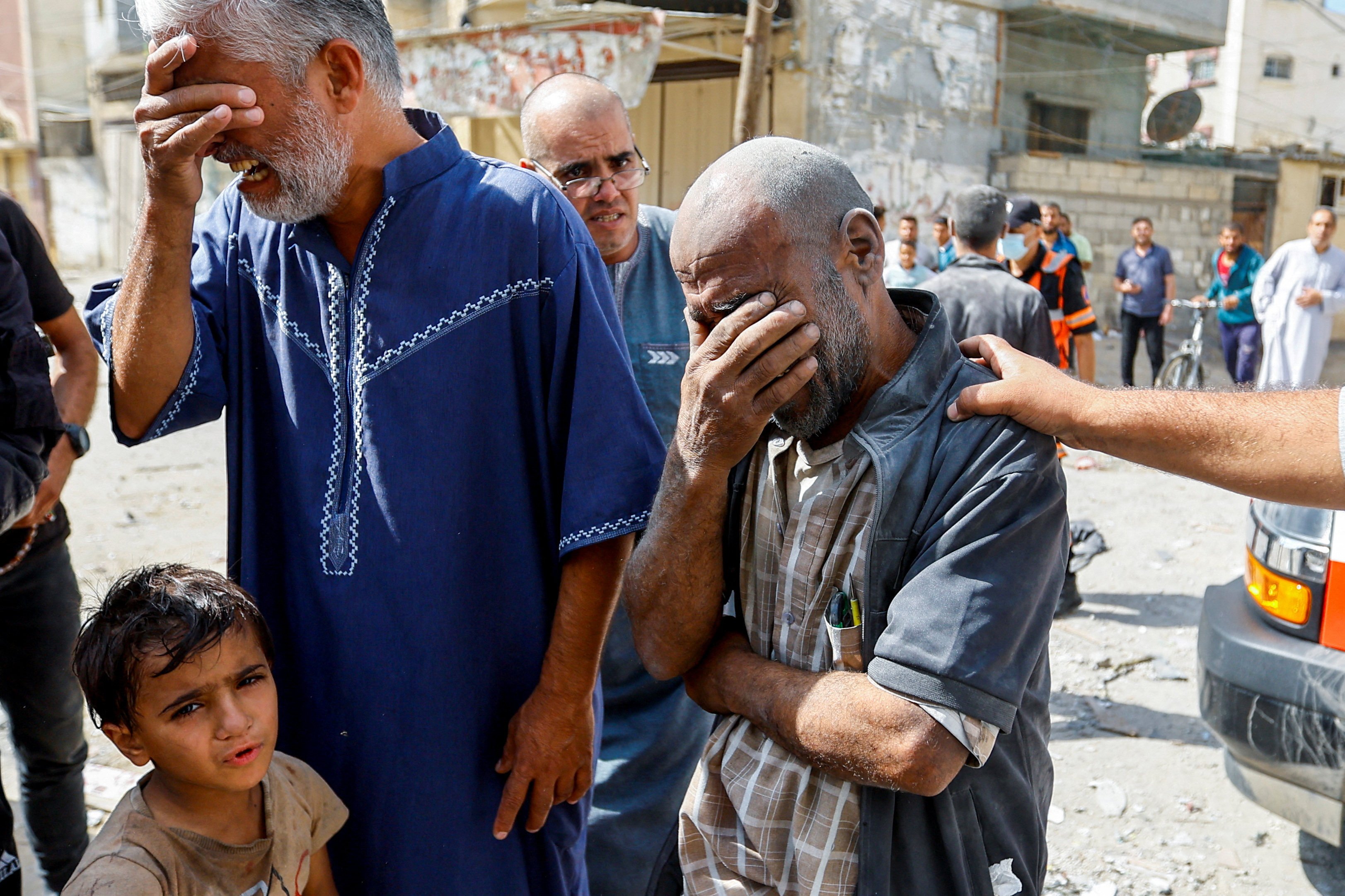 Palestinians react at the site of Israeli strikes on houses in Rafah, in the southern Gaza Strip, on October 17. Photo: Reuters