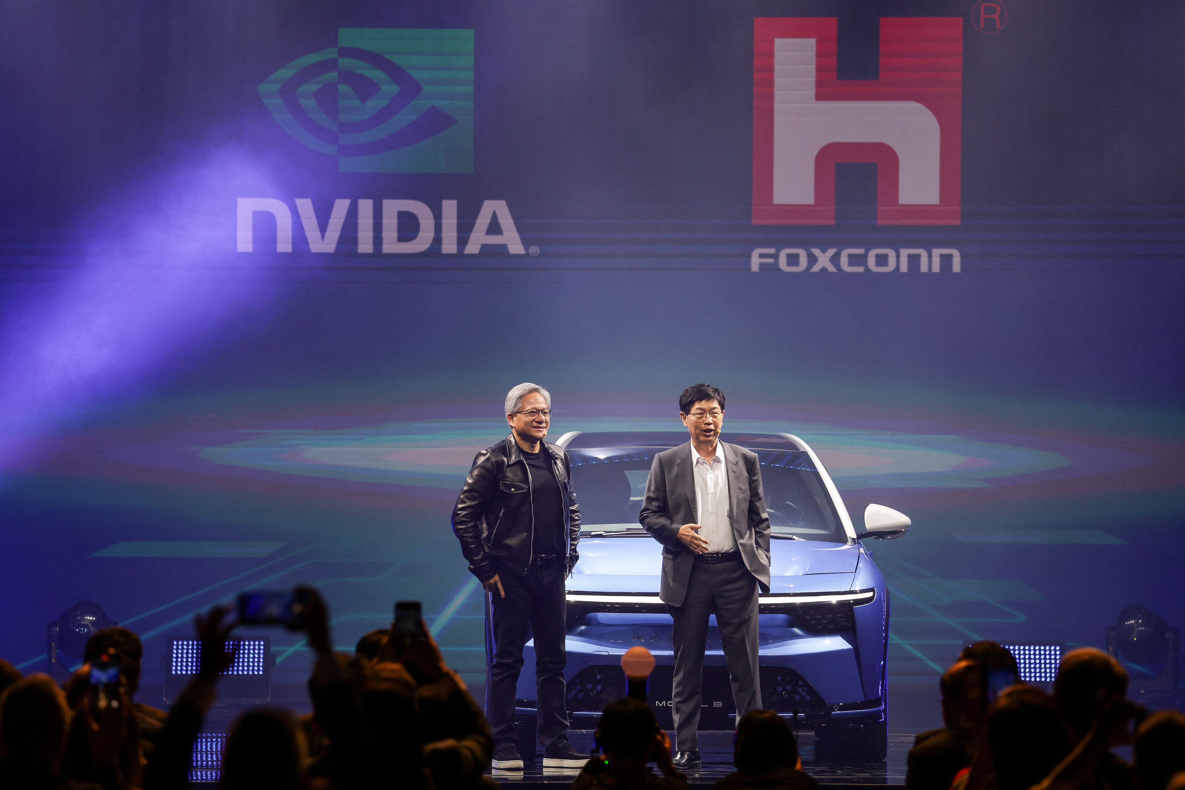 Nvidia Corp chief executive Jensen Huang, left, and Foxconn Technology Group chairman Liu Young-way present the two companies’ latest collaboration at Hon Hai Technology Day in Taipei on October 18, 2023. Photo: Agence France-Presse