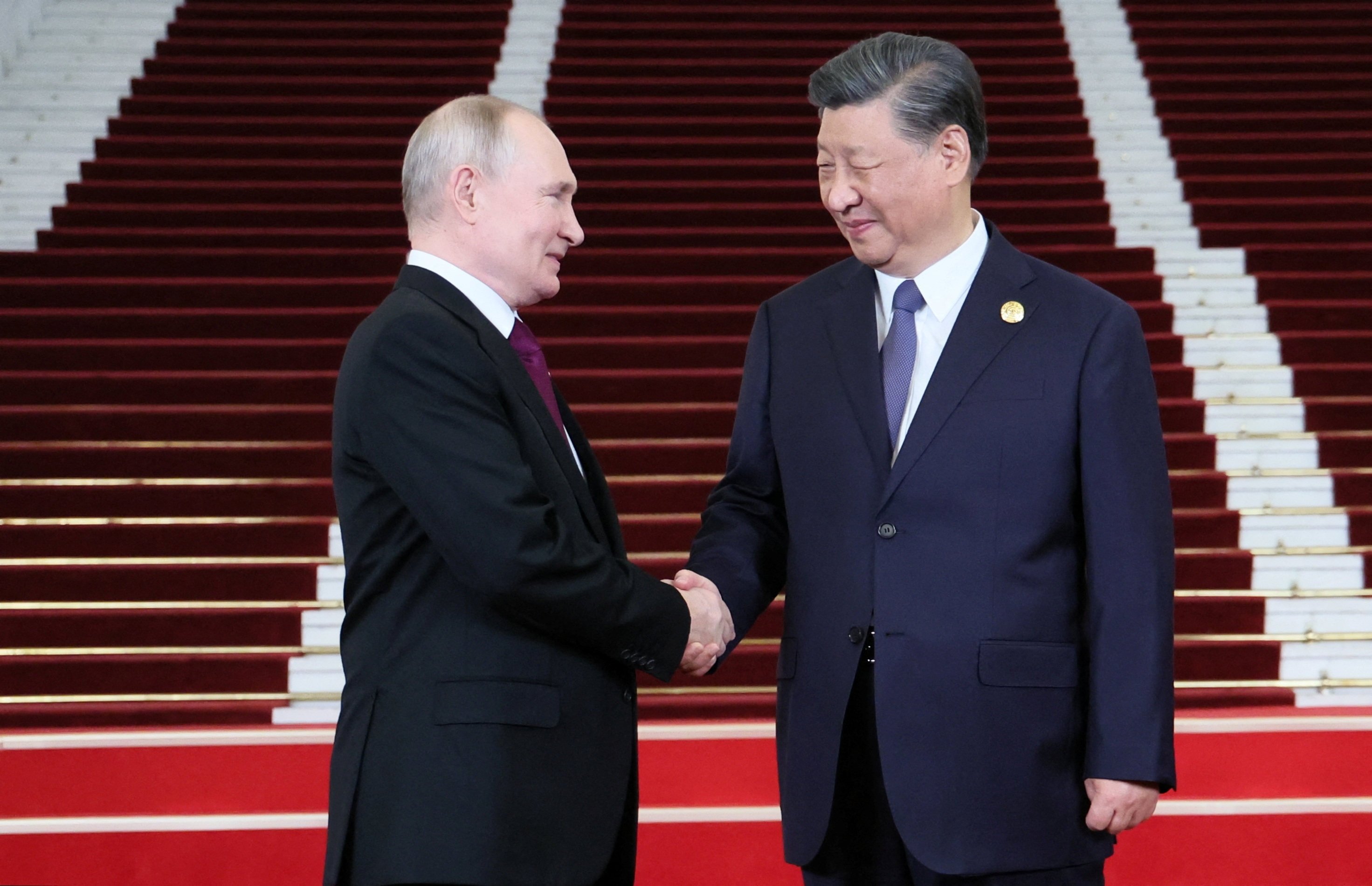 Russian President Vladimir Putin is welcomed by Chinese President Xi Jinping at the Belt and Road Forum in Beijing, China, October 17, 2023. Photo: Reuters