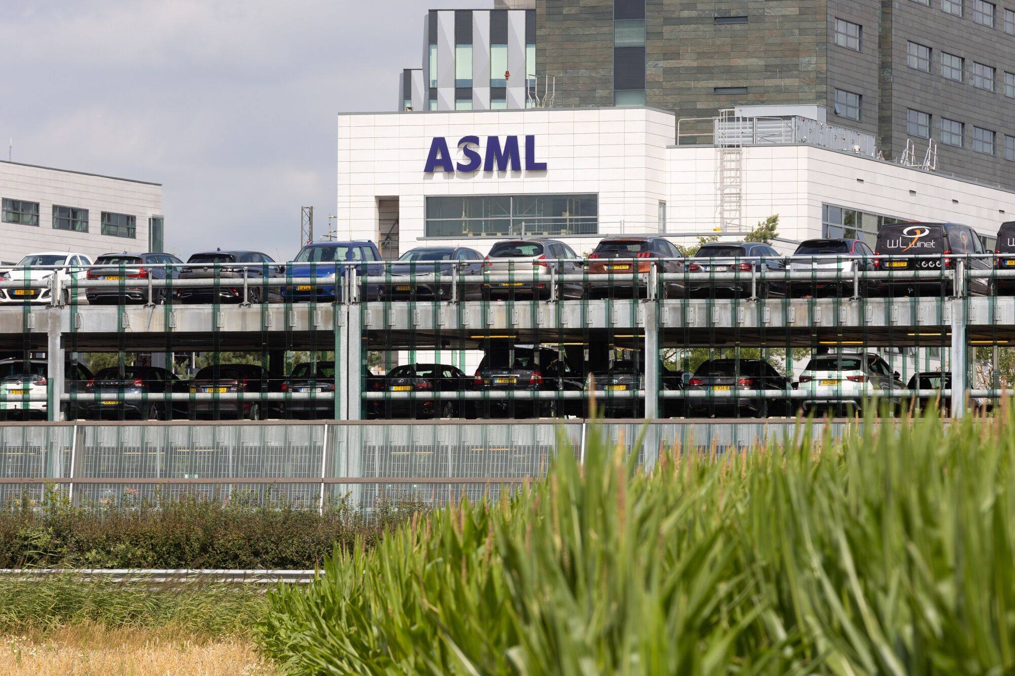 Cars parked at the ASML Holding headquarters and factory in Veldhoven, the Netherlands, on July 19, 2023. Photo: Bloomberg