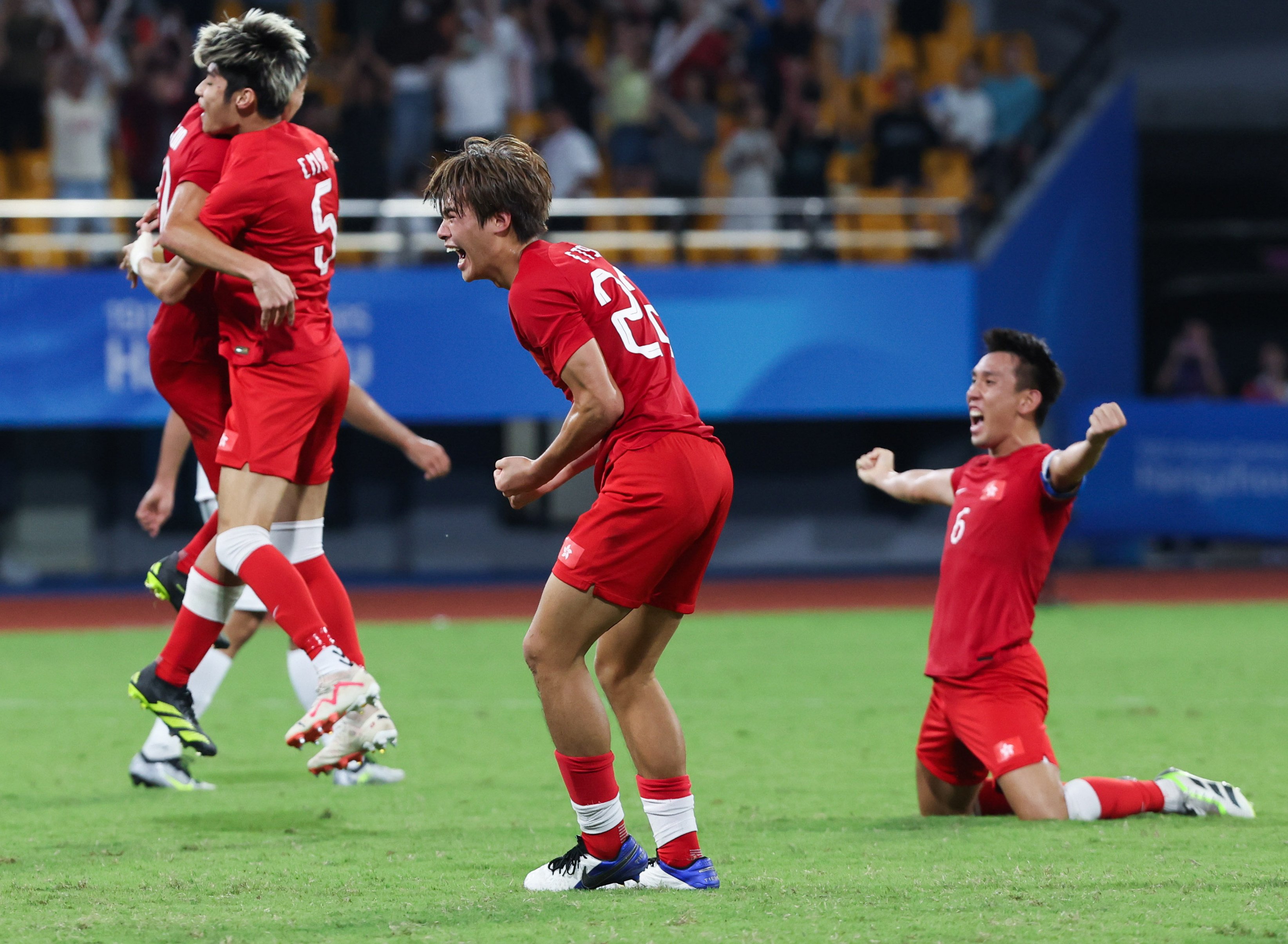 Hong Kong football players celebrate after winning the men’s quarter-final against Iran at the Asian Games in Hangzhou on October 1. Photo: Xinhua 