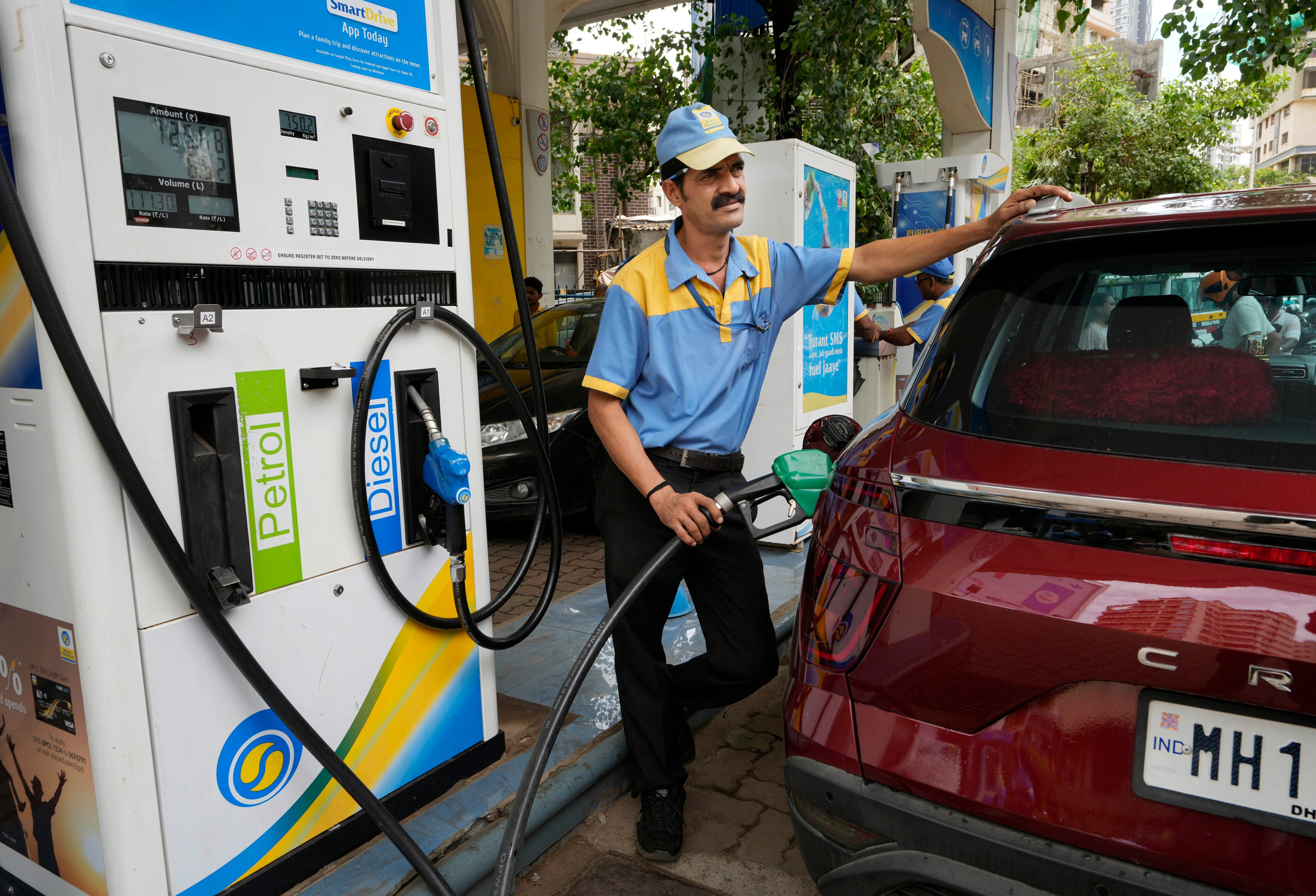 A worker fills petrol in a vehicle at a fuel station in Mumbai. Russia is now the top crude supplier to India, making up almost half of the South Asian nation’s purchases. Photo: AP