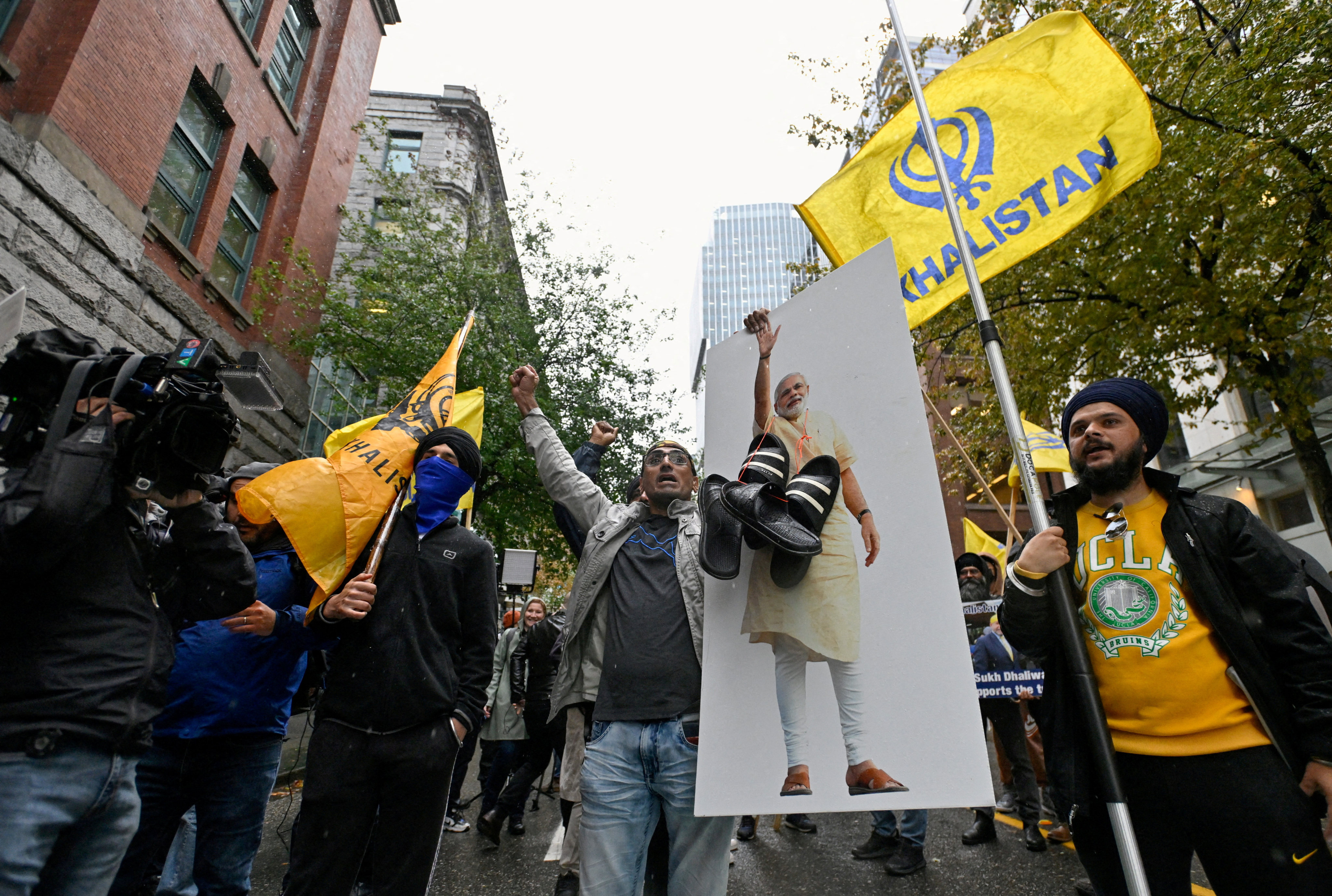 Demonstrators holding flags and signs protest outside India’s consulate in Vancouver, Canada in September. Photo: Reuters
