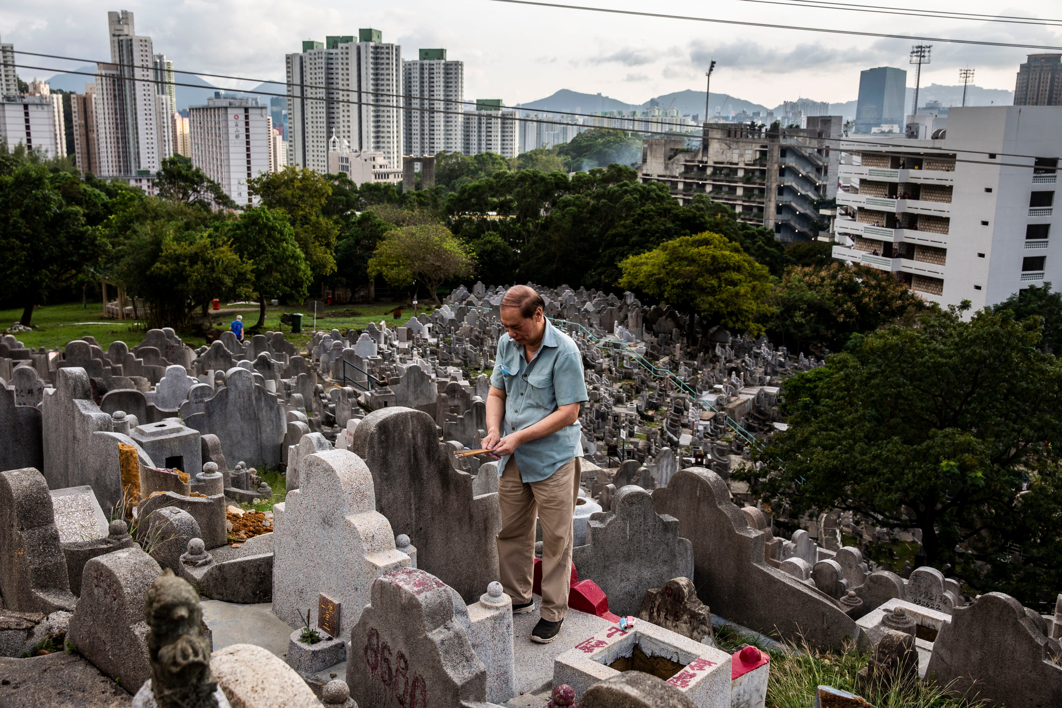 A man pays his respects at a cemetery in Hong Kong in 2021 during the Chung Yeung Festival, also known as the Double Ninth Festival. We take a look at its origins and why so many do not know about it. Photo: AFP