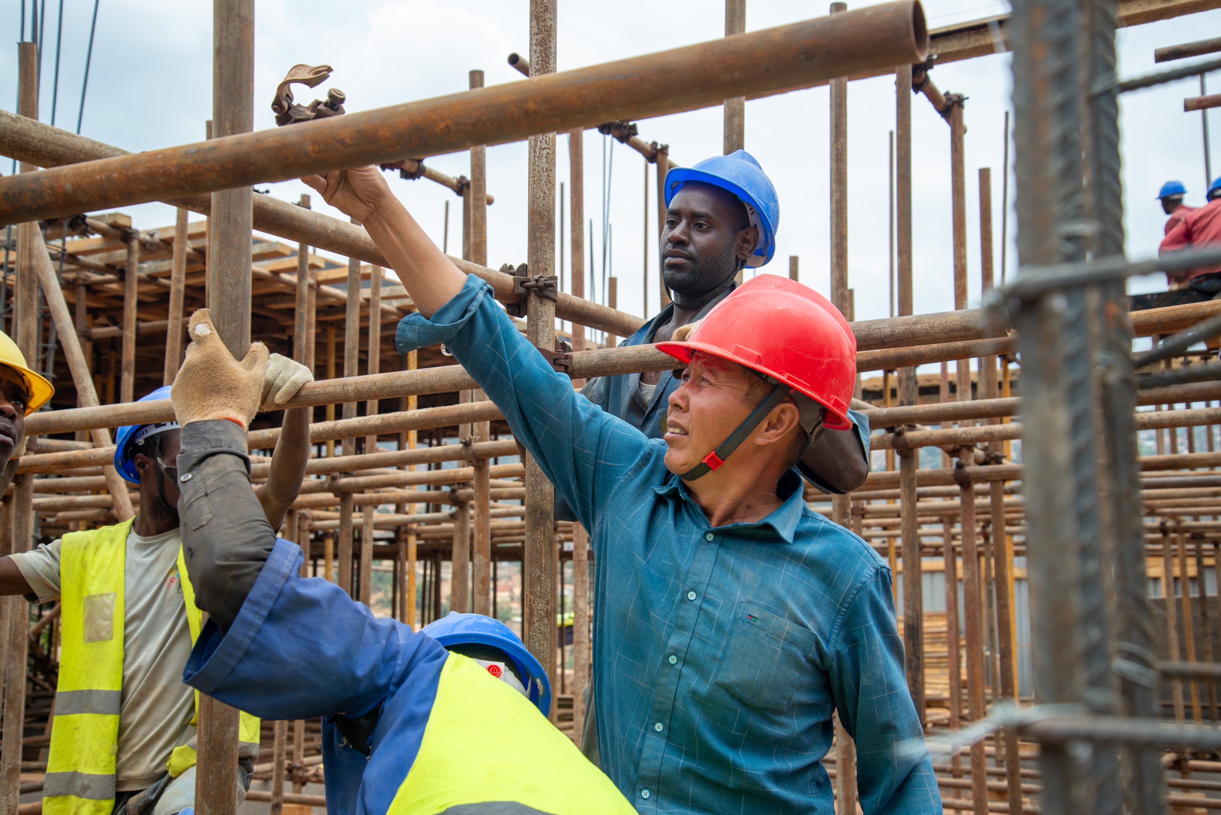 Stecol’s site manager Liu Jin Qi supervises the construction of a two-storey building in Gitega, Kigali, Rwanda. Photo: Chong Xin Wei
