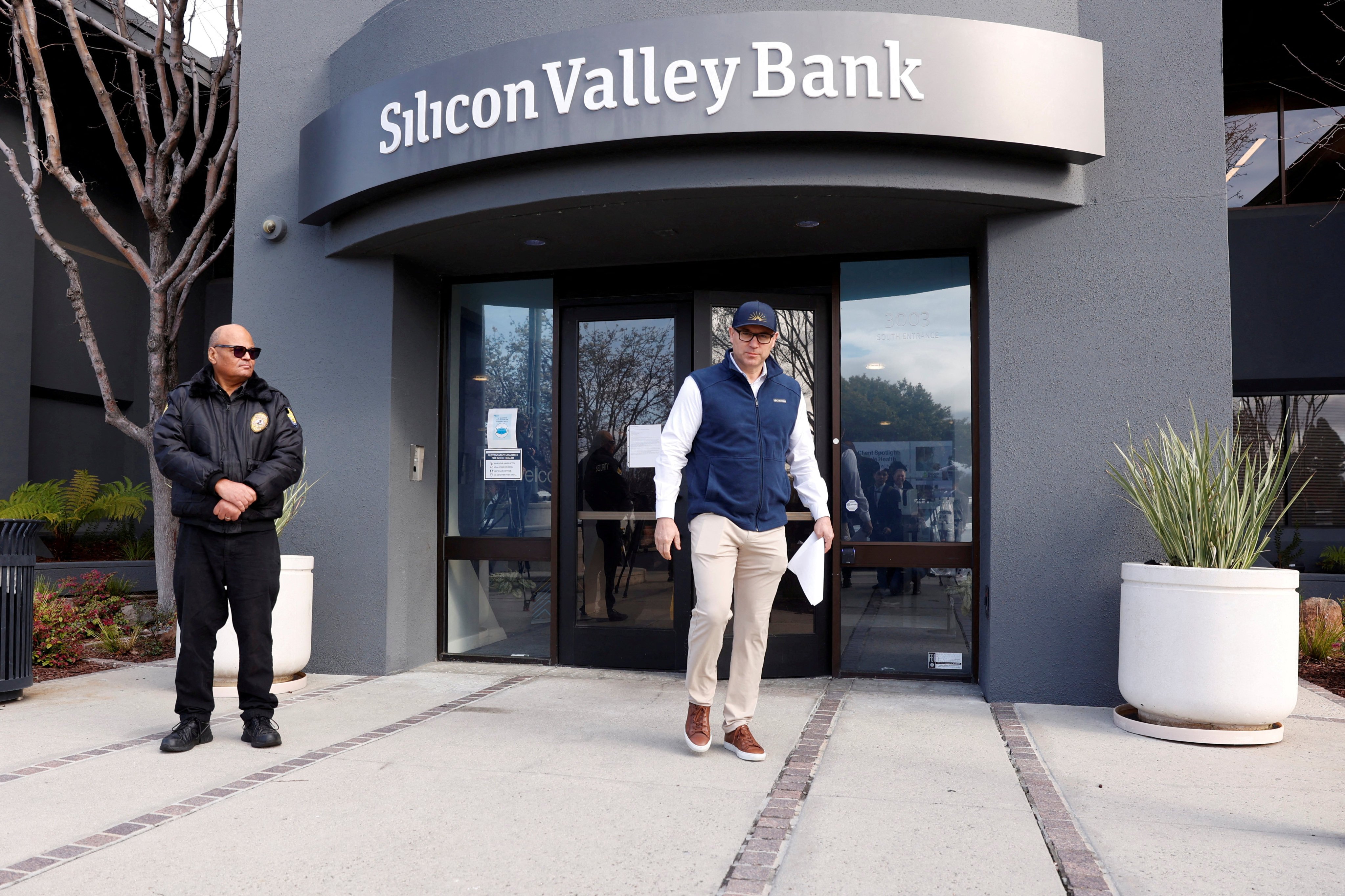 A customer leaves after speaking with FDIC representatives inside of the Silicon Valley Bank headquarters in Santa Clara, California, on March 13. The bank’s collapse earlier this year and the struggles of other regional banks that followed have raised concerns that global financial stability is not what it should be. Photo: Reuters