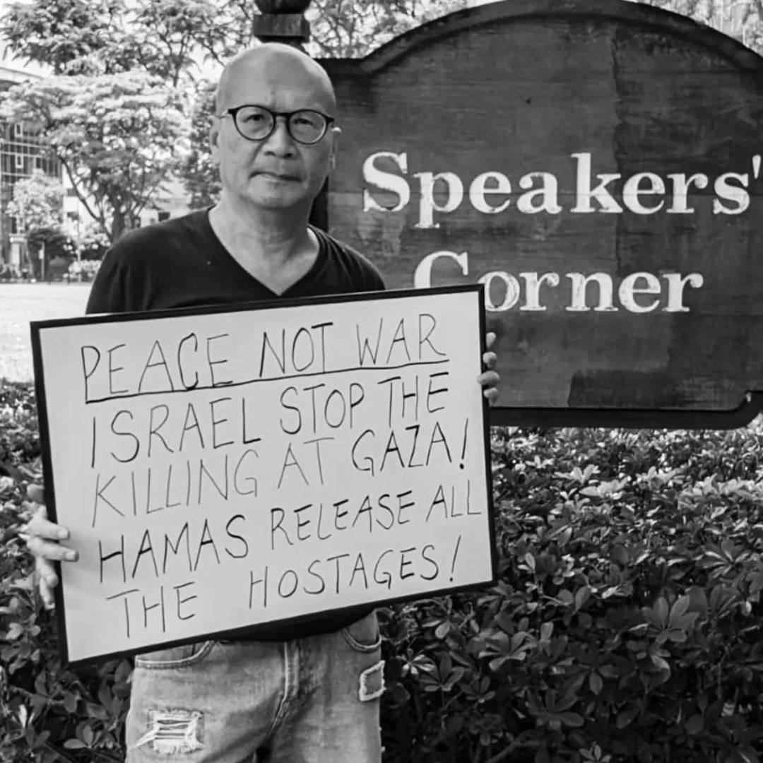 Activist Gilbert Goh holds up a sign on the Israel-Gaza war at Hong Lim Park in Singapore. Photo: Instagram.com/goh.gilbert
