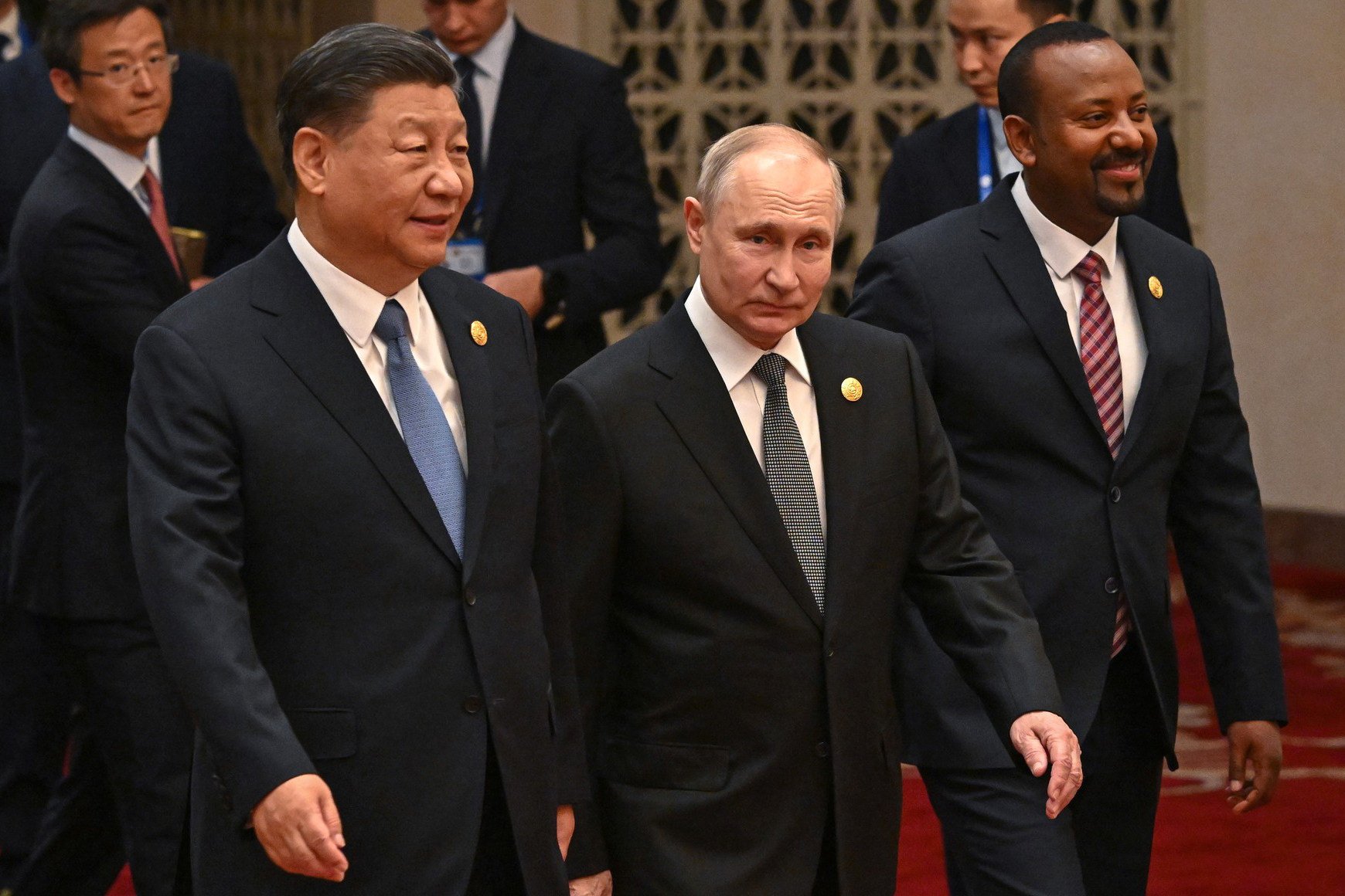 President Xi Jinping (left) and Russian President Vladimir Putin head to a group photo session during the Belt and Road Forum in Beijing on October 18. Representatives from more than 130 countries attended the forum. Photo: dpa